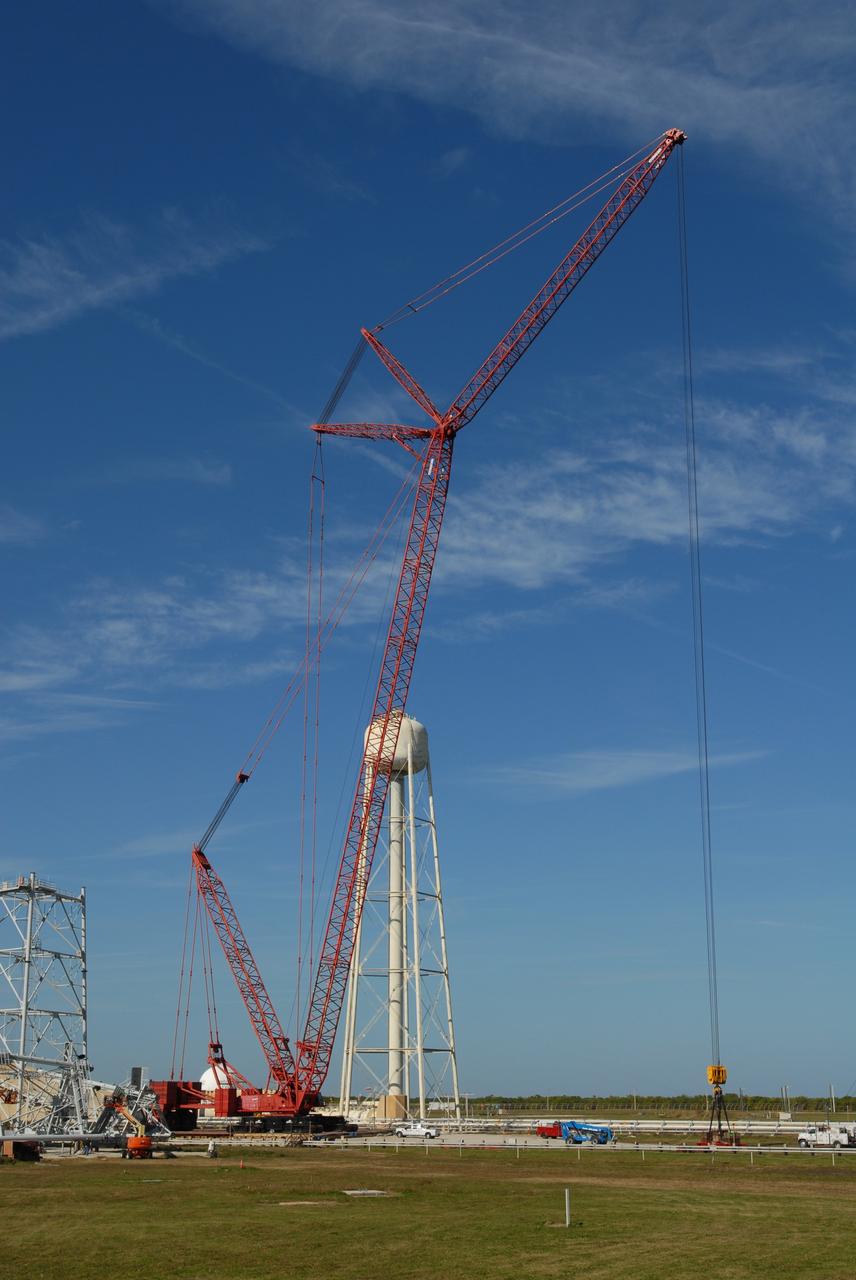 CAPE CANAVERAL, Fla. --  On Launch Pad 39B at NASA's Kennedy Space Center in Florida, a load test is conducted on a giant crane.  The crane will aid in construction of lightning towers that will hold catenary wires as part of the new lightning protection system for the Constellation Program and Ares/Orion launches.  One of the towers under construction is at far left.  Pad 39B will be the site of the first Ares vehicle launch, including the Ares I-X test flight that is targeted for July 2009.  Photo credit: NASA/Jim Grossmann