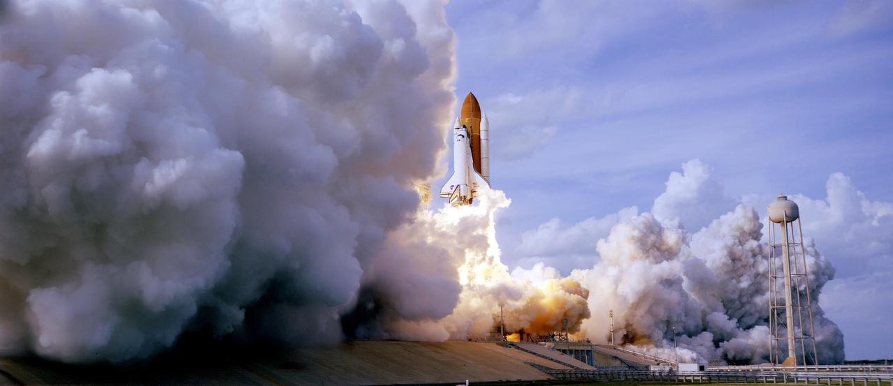 KENNEDY SPACE CENTER, FLA. -- Space shuttle Atlantis is surrounded by clouds of smoke and steam as it lifts off Launch Pad 39A on mission STS-122. At far right is the water tower that provides water for the sound suppression system during liftoff. The shuttle lifted off on time at 2:45 p.m. EST. This is the third launch attempt for Atlantis since December 2007 to carry the European Space Agency's Columbus laboratory to the International Space Station. During the 11-day mission, the crew's prime objective is to attach the laboratory to the Harmony module, adding to the station's size and capabilities. Photo credit: NASA/NASA/Rick Wetherington, Tim Terry, Tim Powers