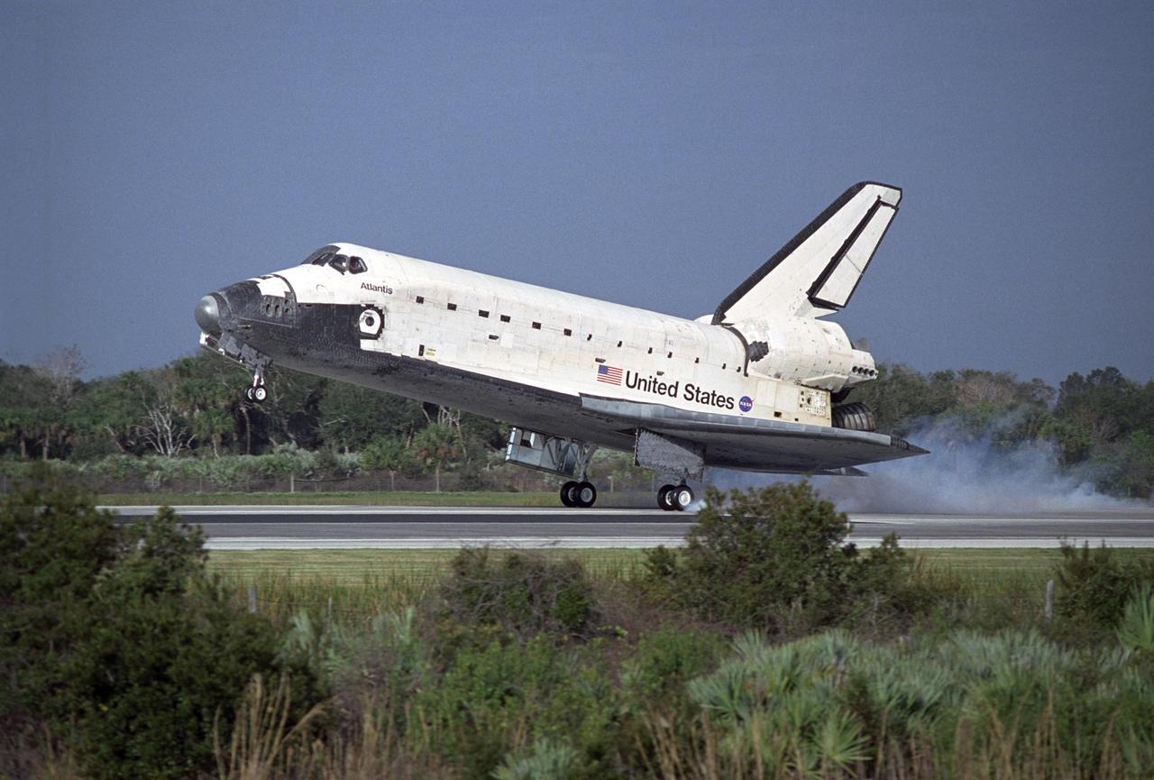 KENNEDY SPACE CENTER, FLA. -- After a nearly 5.3 million mile round trip to the International Space Station, space shuttle Atlantis kicks up dust as it touches down on Runway 15 of the Shuttle Landing Facility at NASA's Kennedy Space Center. The shuttle landed on orbit 202 to complete the 13-day STS-122 mission. Main gear touchdown was 9:07:10 a.m. Nose gear touchdown was 9:07:20 a.m. Wheel stop was at 9:08:08 a.m. Mission elapsed time was 12 days, 18 hours, 21 minutes and 44 seconds. During the mission, Atlantis' crew installed the new Columbus laboratory, leaving a larger space station and one with increased science capabilities. The Columbus Research Module adds nearly 1,000 cubic feet of habitable volume and affords room for 10 experiment racks, each an independent science lab. Photo credit: NASA/Tony Gray