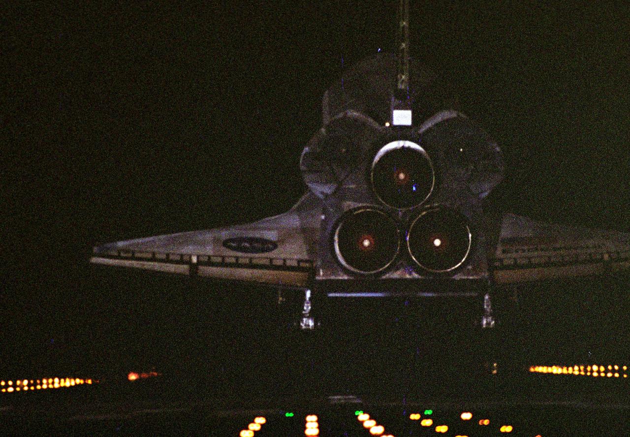 CAPE CANAVERAL, Fla. ---  In the 16th night landing at NASA's Kennedy Space Center, space shuttle Endeavour approaches Runway 15 to end the STS-123 mission, a 16-day flight to the International Space Station.  The main landing gear touched down at 8:39:08 p.m. EDT.  The nose landing gear touched down at 8:39:17 p.m. and wheel stop was at 8:40:41 p.m.  The mission completed nearly 6.6 million miles.  The landing was the second opportunity after the first was waved off due to unstable weather in the Kennedy Space Center area.   Photo credit: NASA/Tony Gray, Kevin O'Connell, Scott Haun