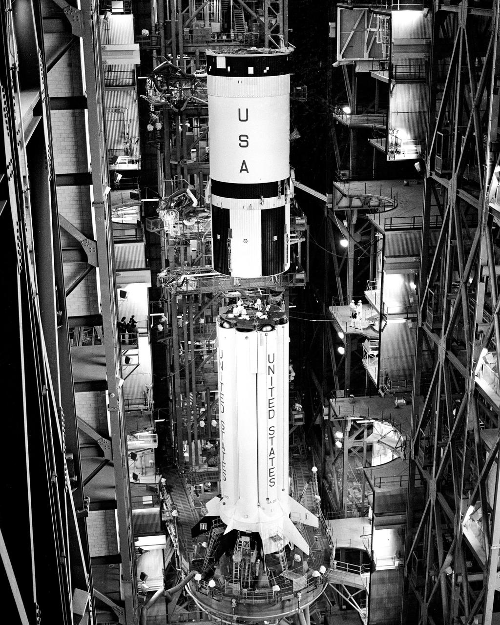 CAPE CANAVERAL, Fla. – The second stage of the Saturn 1B booster for the United States mission on the Apollo Soyuz Test Project was mated with the Saturn 1B first stage in the Kennedy Space Center's Vehicle Assembly Building today.  Mating was completed at 9:50 a.m.  The U. S. ASTP launch with mission commander Thomas Stafford, command module pilot Vance Brand and docking module pilot Donald Slayton is scheduled at 3:50 p.m. EDT July 15.      The first international crewed spaceflight was a joint U.S.-U.S.S.R. rendezvous and docking mission.  The Apollo-Soyuz Test Project, or ASTP, took its name from the spacecraft employed: the American Apollo and the Soviet Soyuz.  The three-man Apollo crew lifted off from Kennedy Space Center aboard a Saturn IB rocket on July 15, 1975, to link up with the Soyuz that had launched a few hours earlier.  A cylindrical docking module served as an airlock between the two spacecraft for transfer of the crew members.  Photo credit: NASA