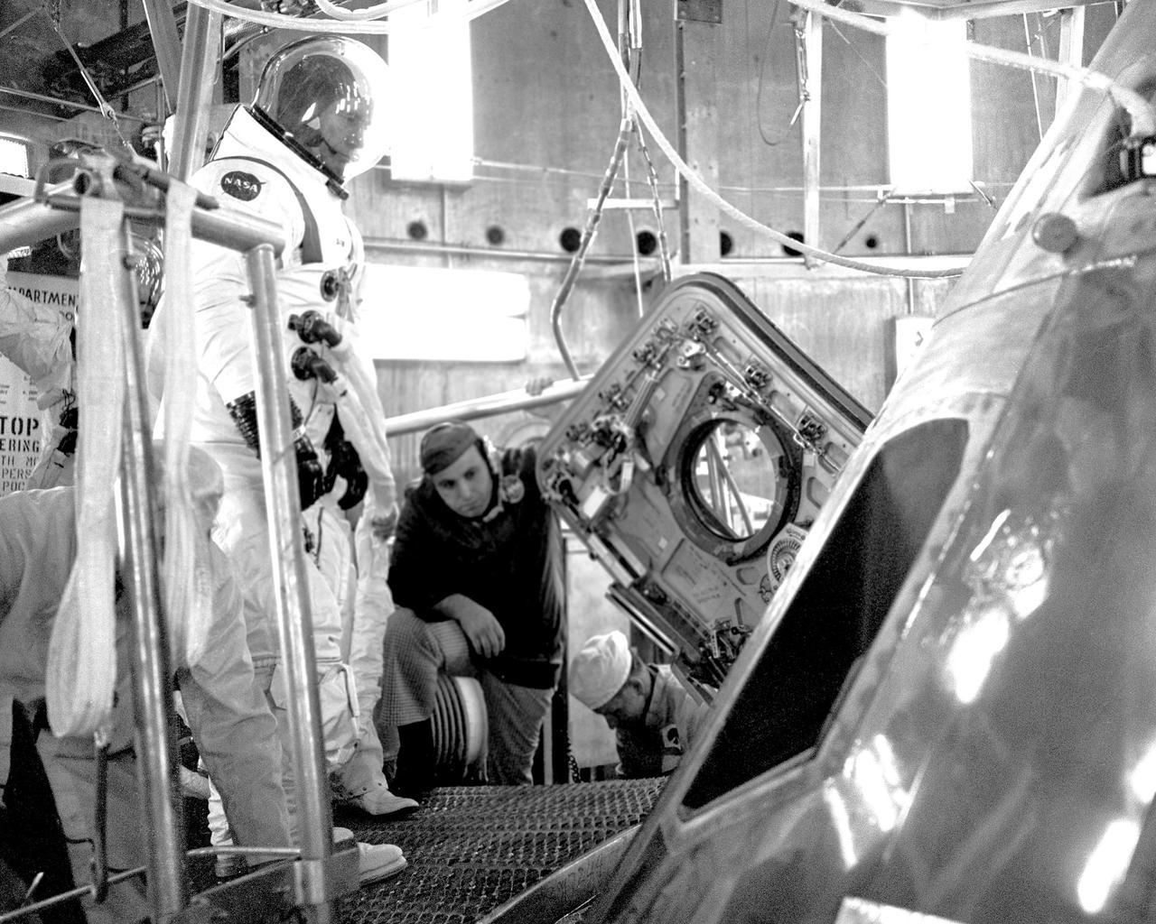 CAPE CANAVERAL, Fla. – The docking module and Apollo spacecraft for this summer's joint manned mission with the Soviet were mated in the Manned Spacecraft Operations Building today.  The docking module will provide a mechanical and electrical link between the Apollo and Soyuz spacecraft while they are docked and also serve as an airlock.  On hand to participate in the operation were two members of the Apollo prime crew, Astronauts Donald K. Slayton and Vance D. Brand.  Launch of the Saturn 1B/Apollo from Complex 39 is scheduled for July 15.      The first international crewed spaceflight was a joint U.S.-U.S.S.R. rendezvous and docking mission.  The Apollo-Soyuz Test Project, or ASTP, took its name from the spacecraft employed: the American Apollo and the Soviet Soyuz.  The three-man Apollo crew lifted off from Kennedy Space Center aboard a Saturn IB rocket on July 15, 1975, to link up with the Soyuz that had launched a few hours earlier.  A cylindrical docking module served as an airlock between the two spacecraft for transfer of the crew members.  Photo credit: NASA