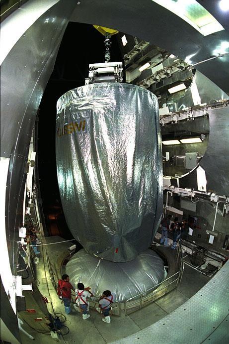 The Cassini spacecraft, covered by an environmentally controlled protective enclosure, is lifted at Launch Complex 40, Cape Canaveral Air Station (CCAS), in preparation to mate it to the top of its Titan IV/Centaur launch vehicle. Cassini is an international mission conducted by the National Aeronautics and Space Administration (NASA), the European Space Agency (ESA), and the Italian Space Agency (ASI). The two-story-tall spacecraft, scheduled for launch on Oct. 13, is destined to arrive at Saturn in July 2004, where it will orbit and study Saturn, its rings, moons and magnetic environment in detail over a four-year period. The Cassini mission is managed for NASA's Office of Space Science by the Jet Propulsion Laboratory, a division of the California Institute of Technology