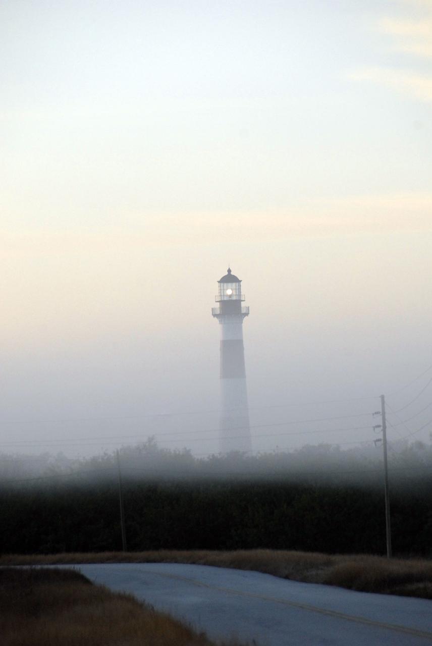 CAPE CANAVERAL, Fla. –  Fog envelops the Cape Canaveral Lighthouse that has graced Cape Canaveral's shore for more than 100 years under the stewardship of the U.S. Air Force. The center shares a boundary with the refuge that includes salt-water estuaries, brackish marshes, hardwood hammocks and pine flatwoods. The diverse landscape provides habitat for more than 310 species of birds, 25 mammals, 117 fishes and 65 amphibians and reptiles. Photo credit: NASA/Jack Pfaller