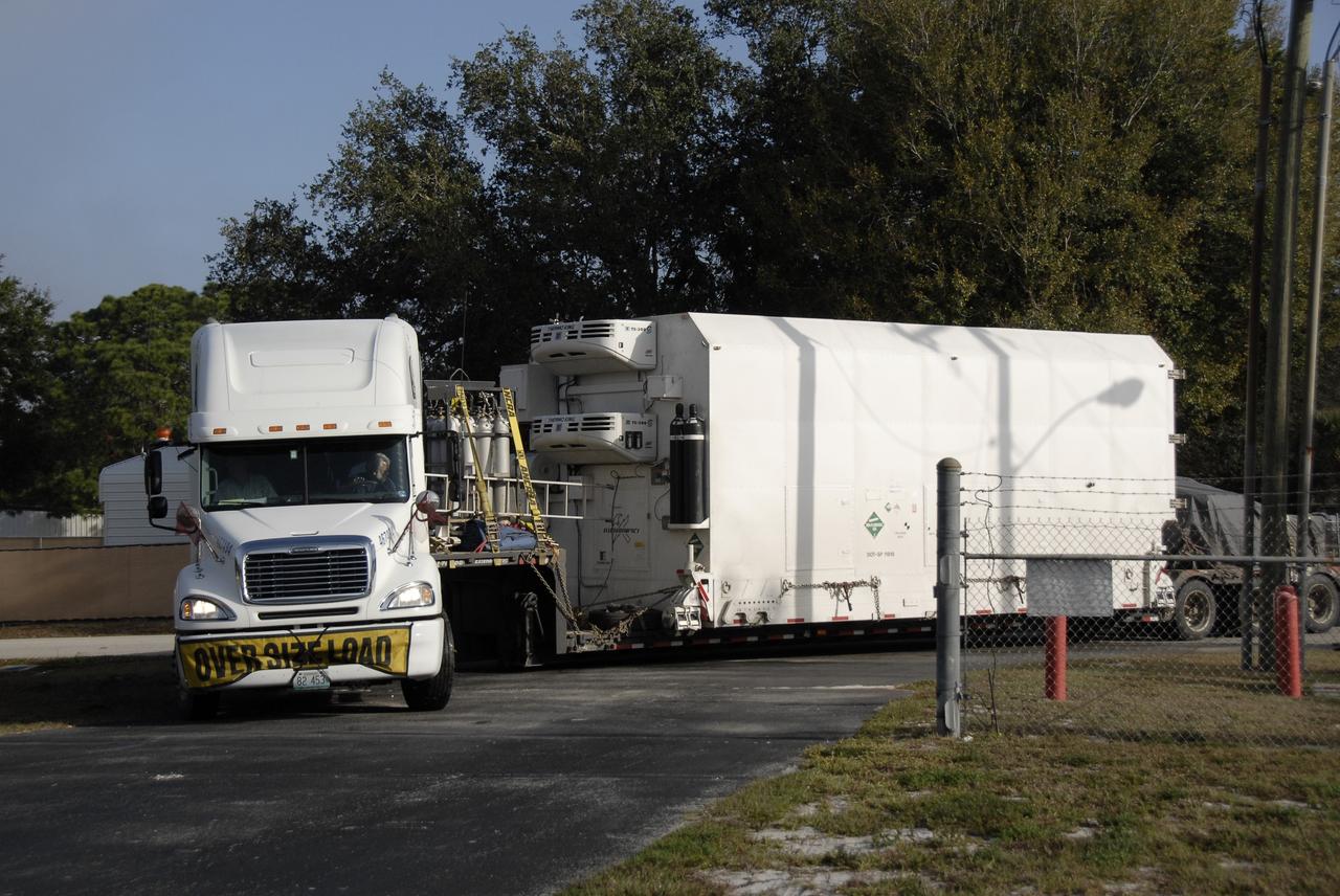 CAPE CANAVERAL, Fla. – A truck with the Kepler spacecraft in tow arrives at Astrotech in Titusville, Fla. A NASA Discovery mission, Kepler is specifically designed to survey our region of the Milky Way galaxy to discover hundreds of Earth-size and smaller planets in or near the habitable zone and determine how many of the billions of stars in our galaxy have such planets. Results from this mission will allow us to place our solar system within the continuum of planetary systems in the Galaxy. The spacecraft will be processed at Astrotech before being carried to its launch pad at Cape Canaveral. .NASA's planet-hunting Kepler mission is scheduled to launch no earlier than March 5, 2009, atop a Delta II rocket. Photo credit: NASA/Kim Shiflett