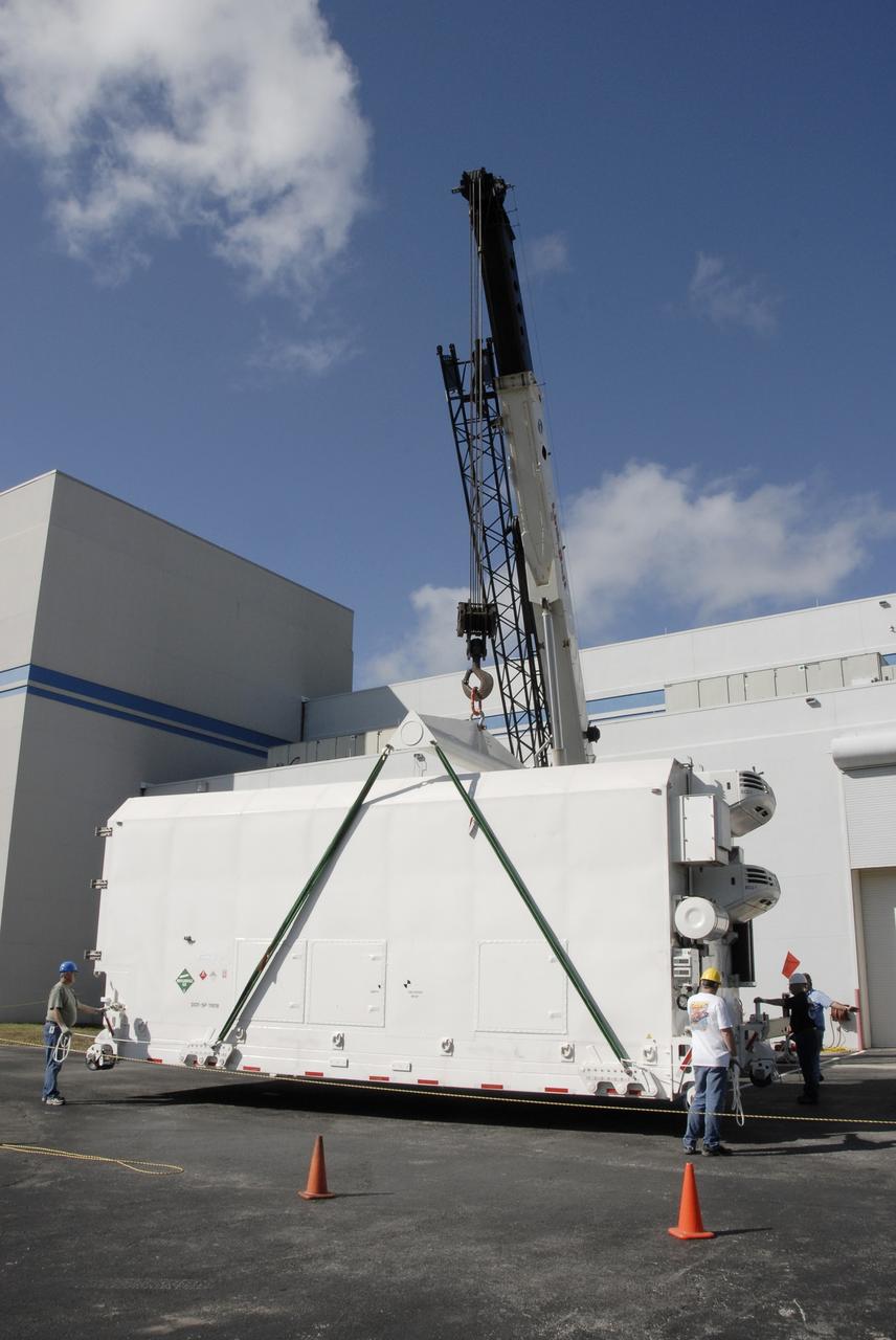 CAPE CANAVERAL, Fla. -- The shipping container holding the Kepler spacecraft is placed on the tarmac outside Astrotech in Titusville, Fla., before being moved inside. A NASA Discovery mission, Kepler is specifically designed to survey our region of the Milky Way galaxy to discover hundreds of Earth-size and smaller planets in or near the habitable zone and determine how many of the billions of stars in our galaxy have such planets. Results from this mission will allow us to place our solar system within the continuum of planetary systems in the Galaxy. The spacecraft will be processed at Astrotech before being carried to its launch pad at Cape Canaveral. .NASA's planet-hunting Kepler mission is scheduled to launch no earlier than March 5, 2009, atop a Delta II rocket. Photo credit: NASA/Kim Shiflett