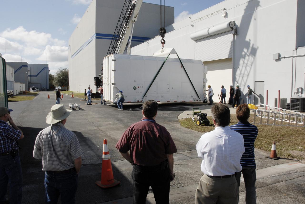 CAPE CANAVERAL, Fla. -- The shipping container holding the Kepler spacecraft is placed on the tarmac outside Astrotech in Titusville, Fla., before being moved inside. A NASA Discovery mission, Kepler is specifically designed to survey our region of the Milky Way galaxy to discover hundreds of Earth-size and smaller planets in or near the habitable zone and determine how many of the billions of stars in our galaxy have such planets. Results from this mission will allow us to place our solar system within the continuum of planetary systems in the Galaxy. The spacecraft will be processed at Astrotech before being carried to its launch pad at Cape Canaveral. .NASA's planet-hunting Kepler mission is scheduled to launch no earlier than March 5, 2009, atop a Delta II rocket. Photo credit: NASA/Kim Shiflett