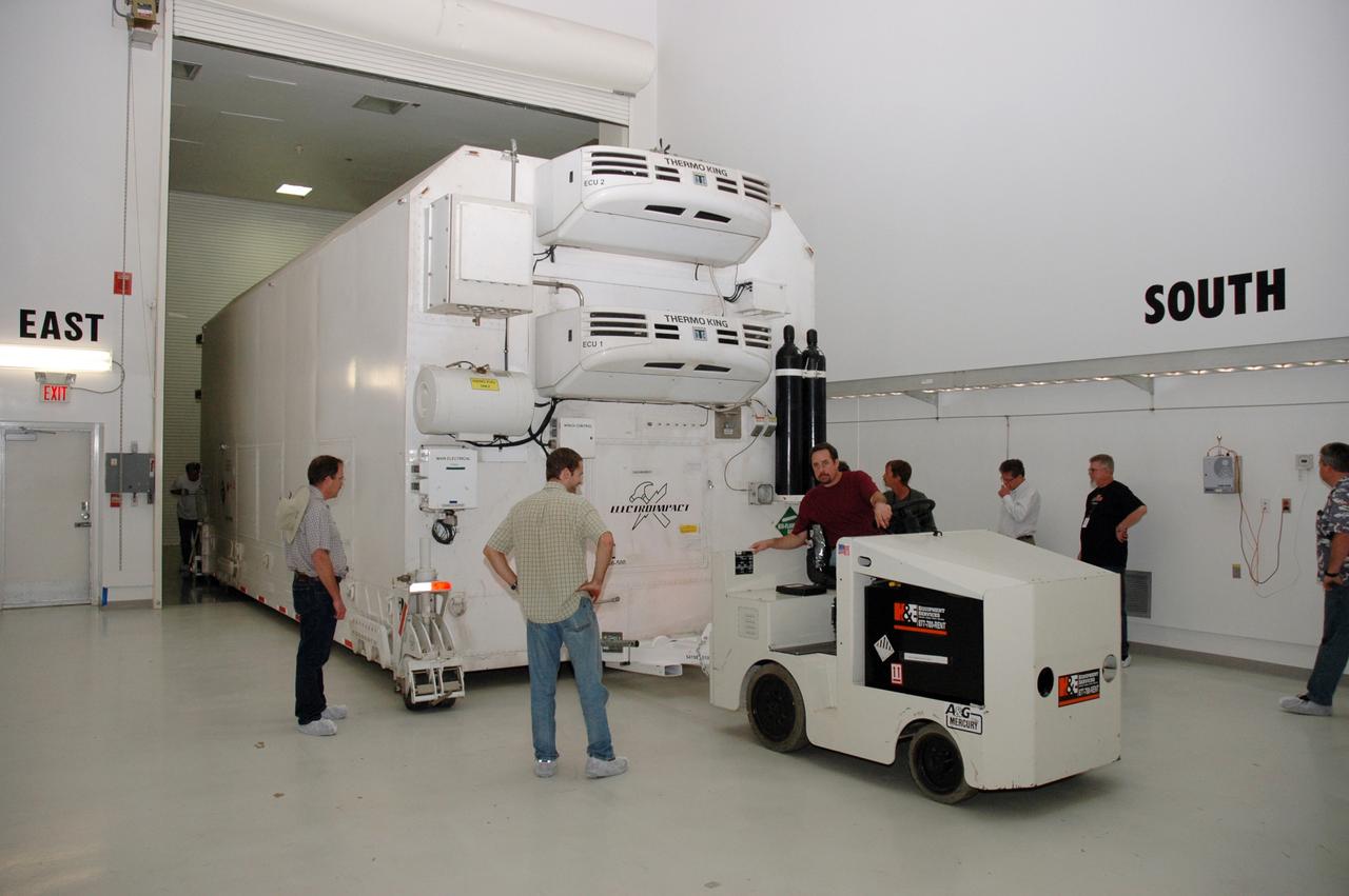 CAPE CANAVERAL, Fla. -- At the Astrotech payload processing facility in Titusville, Fla., the shipping container holding NASA's Kepler spacecraft is moved into a clean room. After removal from the container, the spacecraft will be rotated to vertical, uncovered and prepared for initial testing. A NASA Discovery mission, Kepler is specifically designed to survey our region of the Milky Way galaxy to discover hundreds of Earth-size and smaller planets in or near the habitable zone and determine how many of the billions of stars in our galaxy have such planets. Results from this mission will allow us to place our solar system within the continuum of planetary systems in the Galaxy. After processing at Astrotech, Kepler will be carried to its launch pad at Cape Canaveral. NASA's planet-hunting Kepler mission is scheduled to launch no earlier than March 5 atop a Delta II rocket. Photo credit: NASA/Chris Rhodes
