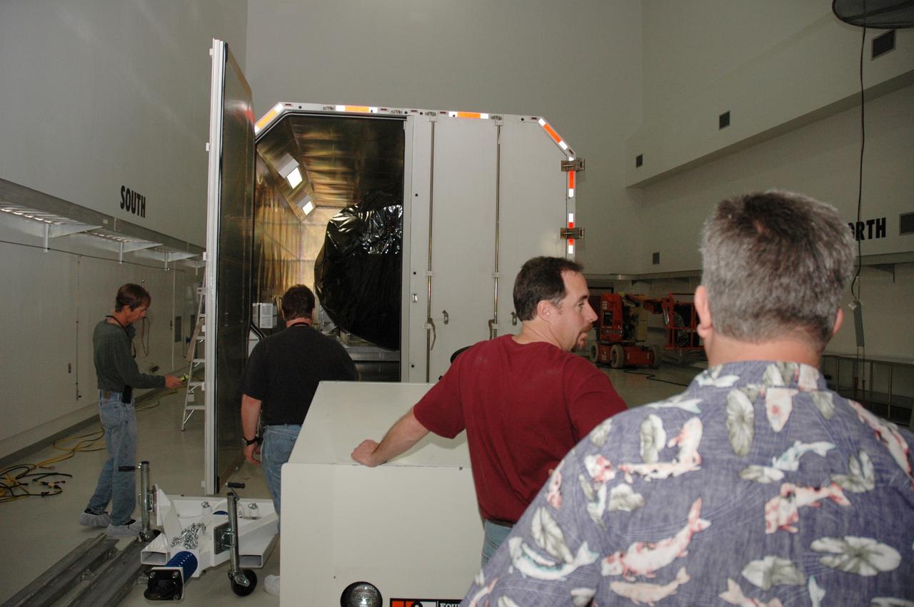 CAPE CANAVERAL, Fla. -- At the Astrotech payload processing facility in Titusville, Fla., doors are opened on the shipping container holding NASA's Kepler spacecraft. After removal from the container, the spacecraft will be rotated to vertical, uncovered and prepared for initial testing. A NASA Discovery mission, Kepler is specifically designed to survey our region of the Milky Way galaxy to discover hundreds of Earth-size and smaller planets in or near the habitable zone and determine how many of the billions of stars in our galaxy have such planets. Results from this mission will allow us to place our solar system within the continuum of planetary systems in the Galaxy. After processing at Astrotech, Kepler will be carried to its launch pad at Cape Canaveral. NASA's planet-hunting Kepler mission is scheduled to launch no earlier than March 5 atop a Delta II rocket. Photo credit: NASA/Chris Rhodes