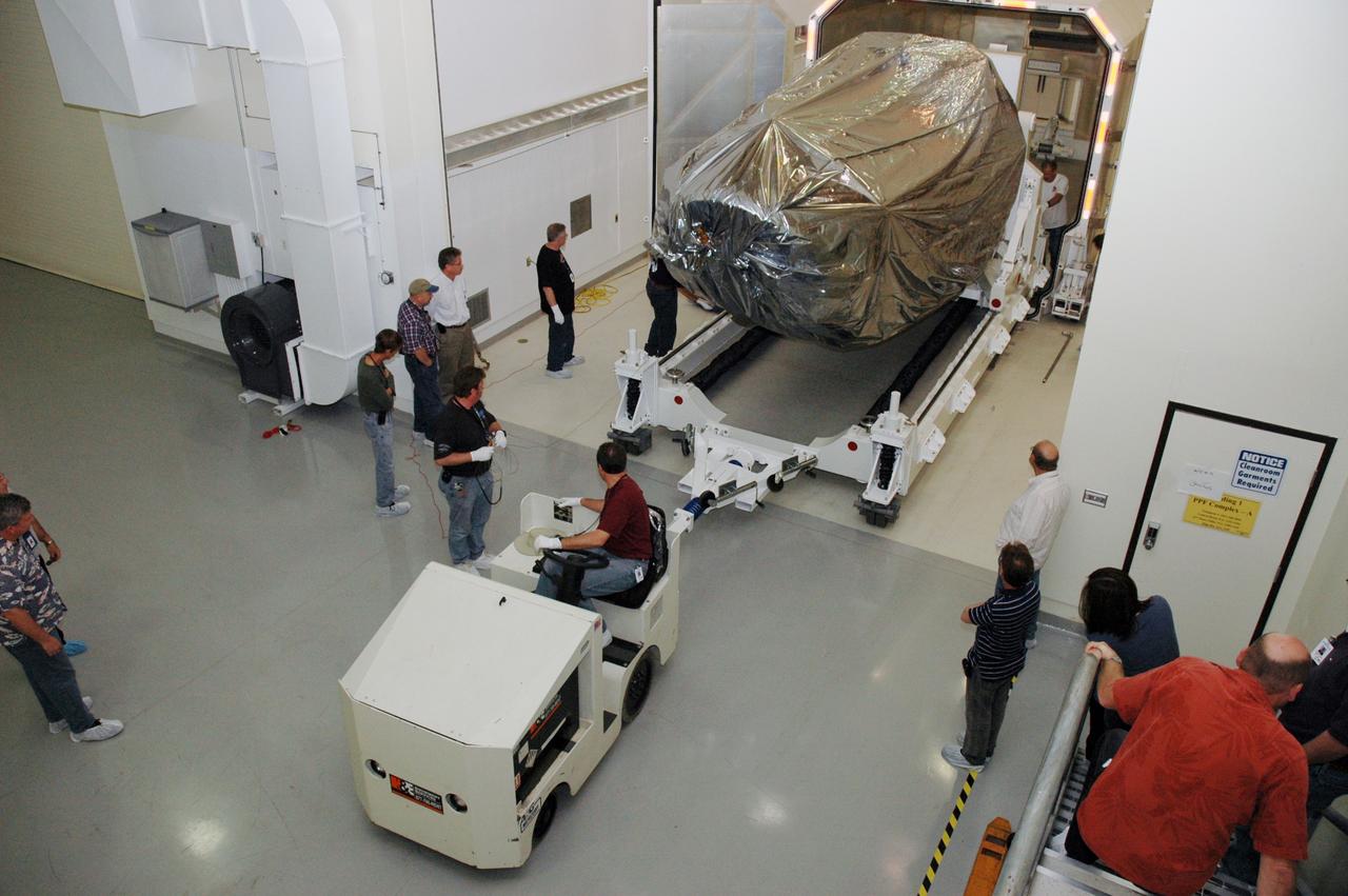 CAPE CANAVERAL, Fla. -- At the Astrotech payload processing facility in Titusville, Fla., NASA's Kepler spacecraft is rolled out of its shipping container. The spacecraft will be rotated to vertical, uncovered and prepared for initial testing. A NASA Discovery mission, Kepler is specifically designed to survey our region of the Milky Way galaxy to discover hundreds of Earth-size and smaller planets in or near the habitable zone and determine how many of the billions of stars in our galaxy have such planets. Results from this mission will allow us to place our solar system within the continuum of planetary systems in the Galaxy. After processing at Astrotech, Kepler will be carried to its launch pad at Cape Canaveral. NASA's planet-hunting Kepler mission is scheduled to launch no earlier than March 5 atop a Delta II rocket. Photo credit: NASA/Chris Rhodes