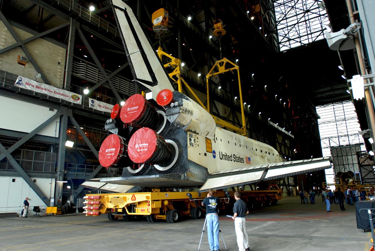 CAPE CANAVERAL, Fla. -- Aboard its transporter, space shuttle Discovery rolls into the transfer aisle of the Vehicle Assembly Building at NASA's Kennedy Space Center in Florida. Discovery left Orbiter Processing Facility 3 at 2:30 p.m. EST. In the VAB, Discovery will be attached to its external fuel tank and twin solid rocket boosters. After additional preparations are made, the shuttle will be rolled out to Launch Pad 39A for a targeted launch to the International Space Station on Feb. 12. Photo credit: NASA/Jim Grossmann
