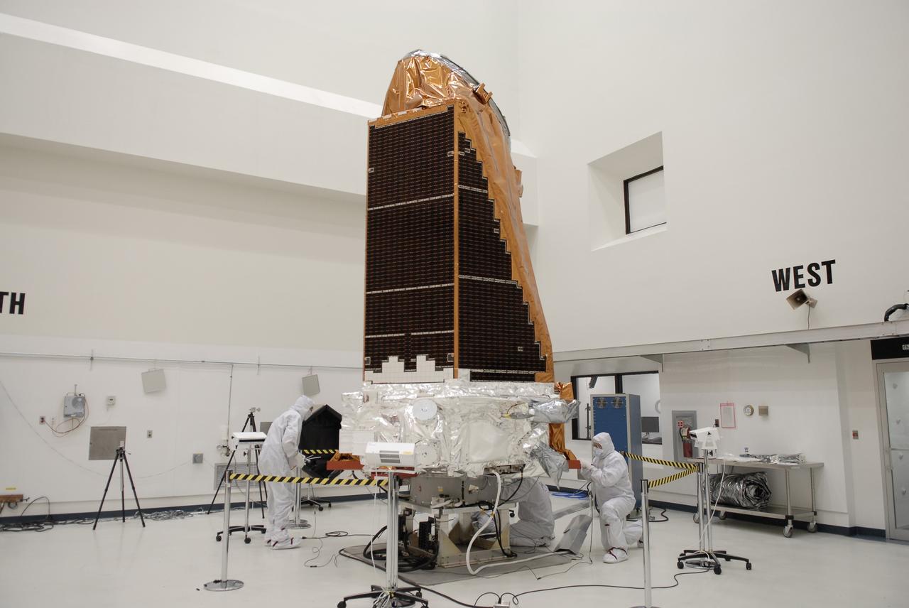 CAPE CANAVERAL, Fla. -- At the Astrotech payload processing facility in Titusville, Fla., workers from Ball Aerospace check the star trackers on NASA's Kepler spacecraft before testing. Star Trackers are small aperture, space-qualified optical products which assure a spacecraft’s accurate navigation in space. A NASA Discovery mission, Kepler is specifically designed to survey our region of the Milky Way galaxy to discover hundreds of Earth-size and smaller planets in or near the habitable zone and determine how many of the billions of stars in our galaxy have such planets. Results from this mission will allow us to place our solar system within the continuum of planetary systems in the Galaxy. After processing at Astrotech, Kepler will be carried to its launch pad at Cape Canaveral. .NASA's planet-hunting Kepler mission is scheduled to launch no earlier than March 5 atop a Delta II rocket. Photo credit: NASA/Kim Shiflett