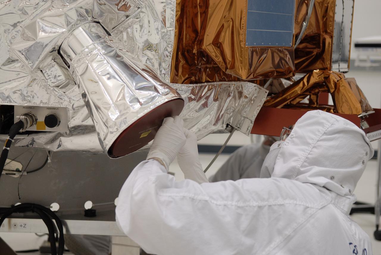 CAPE CANAVERAL, Fla. -- At the Astrotech payload processing facility in Titusville, Fla., NASA's Kepler spacecraft is prepared for testing. A NASA Discovery mission, Kepler is specifically designed to survey our region of the Milky Way galaxy to discover hundreds of Earth-size and smaller planets in or near the habitable zone and determine how many of the billions of stars in our galaxy have such planets. Results from this mission will allow us to place our solar system within the continuum of planetary systems in the Galaxy. After processing at Astrotech, Kepler will be carried to its launch pad at Cape Canaveral. .NASA's planet-hunting Kepler mission is scheduled to launch no earlier than March 5 atop a Delta II rocket. Photo credit: NASA/Kim Shiflett