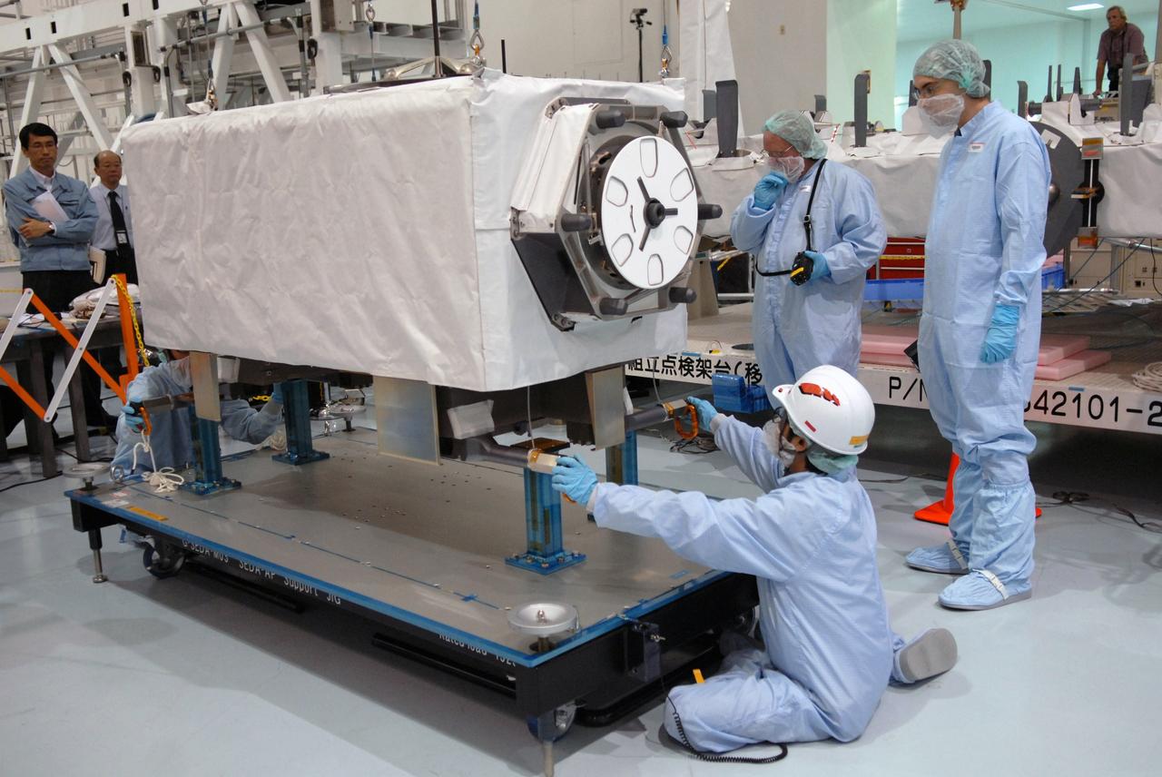 CAPE CANAVERAL, Fla. -- In the Space Station Processing Facility at NASA's Kennedy Space Center in Florida, an overhead crane lifts the SEDA-AP (Space Environment Data Acquisition Equipment-Attached Payload). The payload will be installed on the Japanese Experiment Module's Experiment Logistics Module-Exposed Section, or ELM-ES. The SEDA-AP and ELM-ES are part of space shuttle Endeavour's payload for the STS-127 mission. SEDA-AP will measure space environment in ISS orbit and environmental effects on materials and electronic devices to investigate the interaction with and from the environment at the Kibo exposed facility. Endeavour is targeted to launch May 15. Photo credit: NASA/Troy Cryder
