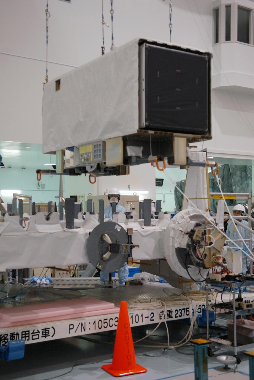 CAPE CANAVERAL, Fla. -- In the Space Station Processing Facility at NASA's Kennedy Space Center in Florida, the SEDA-AP (Space Environment Data Acquisition Equipment-Attached Payload) is lowered toward the Japanese Experiment Module's Experiment Logistics Module-Exposed Section, or ELM-ES for installation. The SEDA-AP and ELM-ES are part of space shuttle Endeavour's payload for the STS-127 mission. SEDA-AP will measure space environment in ISS orbit and environmental effects on materials and electronic devices to investigate the interaction with and from the environment at the Kibo exposed facility. Endeavour is targeted to launch May 15. Photo credit: NASA/Troy Cryder