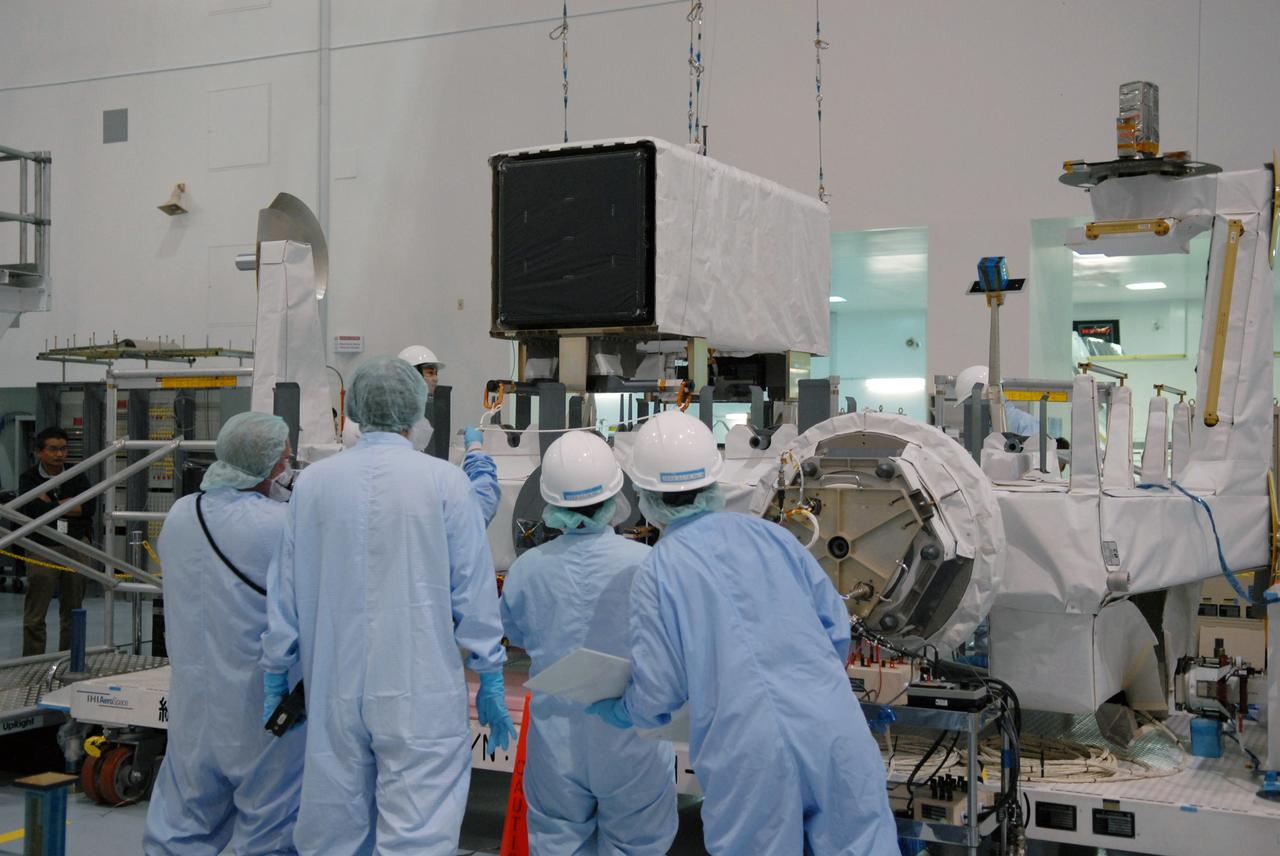 CAPE CANAVERAL, Fla. -- In the Space Station Processing Facility at NASA's Kennedy Space Center in Florida, the SEDA-AP (Space Environment Data Acquisition Equipment-Attached Payload) is lowered onto the Japanese Experiment Module's Experiment Logistics Module-Exposed Section, or ELM-ES for installation. The SEDA-AP and ELM-ES are part of space shuttle Endeavour's payload for the STS-127 mission. SEDA-AP will measure space environment in ISS orbit and environmental effects on materials and electronic devices to investigate the interaction with and from the environment at the Kibo exposed facility. Endeavour is targeted to launch May 15. Photo credit: NASA/Troy Cryder