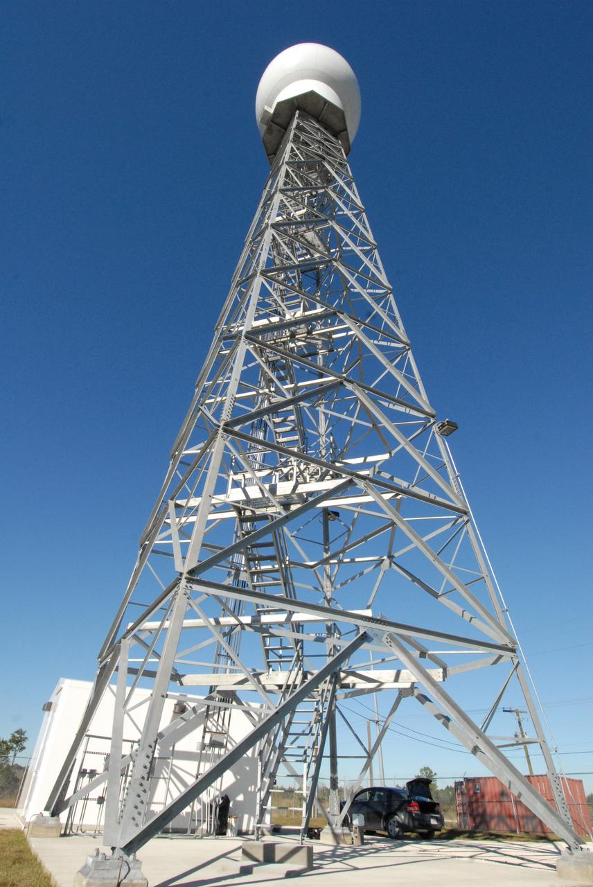 CAPE CANAVERAL, Fla. -- A replacement weather Doppler radar has been installed in the radome on top of this tower in a remote field located west of NASA's Kennedy Space Center in Florida. The dome houses the rotating antenna and pedestal and protects them from the elements. The tower is 100 feet high; the radome is 22 feet in diameter, the antenna 14 feet in diameter. It rotates at 6 rpm. The structure can withstand 130 mph winds. It is undergoing initial testing and expected to become operational in the summer. The weather radar is essential in issuing lightning and other severe weather warnings and vital in evaluating lightning launch commit criteria for space shuttle and rocket launches. Photo credit: NASA/Troy Cryder