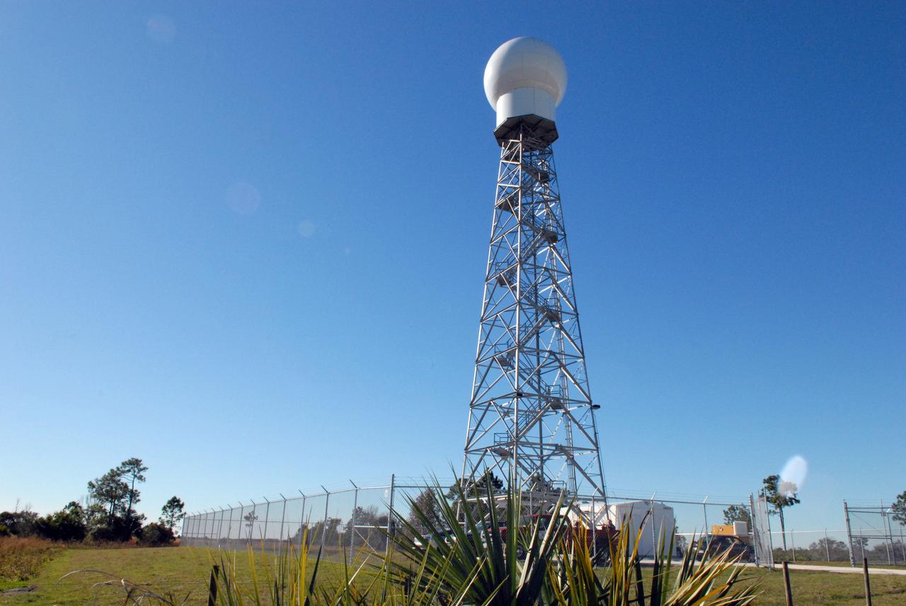 CAPE CANAVERAL, Fla. -- A replacement weather Doppler radar has been installed on top of this tower in a remote field located west of NASA's Kennedy Space Center in Florida. The radome houses the rotating antenna and pedestal and protects them from the elements. The tower is 100 feet high; the radome is 22 feet in diameter, the antenna 14 feet in diameter. It rotates at 6 rpm. The structure can withstand 130 mph winds. It is undergoing initial testing and expected to become operational in the summer. The weather radar is essential in issuing lightning and other severe weather warnings and vital in evaluating lightning launch commit criteria for space shuttle and rocket launches. Photo credit: NASA/Troy Cryder
