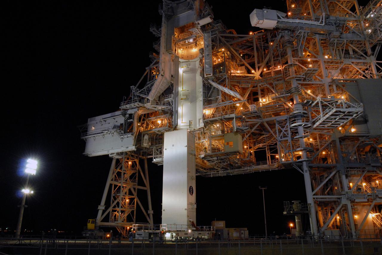CAPE CANAVERAL, Fla. --  The payload canister containing the S6 truss and solar arrays arrives at Launch Pad 39A at NASA's Kennedy Space Center in Florida. The canister sits below the Payload Changeout Room, or PCR. It will be lifted up to the PCR and space shuttle Discovery's payload transferred inside. After Discovery rolls out to the pad, the payload will be installed in the shuttle's payload bay. Launch of Discovery on the STS-119 mission is scheduled for Feb. 12. During Discovery's 14-day mission, the crew will install the S6 truss segment and its solar arrays to the starboard side of the station, completing the station's backbone, or truss Photo credit: NASA/Jim Grossmann