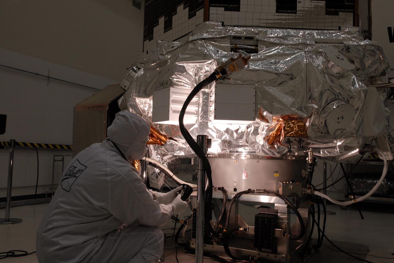 CAPE CANAVERAL, Fla. -- At the Astrotech payload processing facility in Titusville, Fla., a Ball Aerospace and Technologies Corp. worker conducts a light sensor test on NASA's Kepler spacecraft. A NASA Discovery mission, Kepler is specifically designed to survey our region of the Milky Way galaxy to discover hundreds of Earth-size and smaller planets in or near the habitable zone and determine how many of the billions of stars in our galaxy have such planets. Results from this mission will allow us to place our solar system within the continuum of planetary systems in the Galaxy. After processing at Astrotech, Kepler will be carried to its launch pad at Cape Canaveral Air Force Station. .NASA's planet-hunting Kepler mission is scheduled to launch no earlier than March 5 atop a United Launch Alliance Delta II rocket. Photo credit: NASA/Kim Shiflett