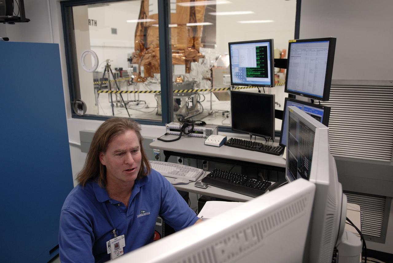 CAPE CANAVERAL, Fla. --  At the Astrotech payload processing facility in Titusville, Fla., a Ball Aerospace and Technologies Corp. technician Phil Mislinski checks data from the light sensor test conducted on NASA's Kepler spacecraft. Ball Aerospace was responsible for the flight segment design and fabrication. A NASA Discovery mission, Kepler is specifically designed to survey our region of the Milky Way galaxy to discover hundreds of Earth-size and smaller planets in or near the habitable zone and determine how many of the billions of stars in our galaxy have such planets. Results from this mission will allow us to place our solar system within the continuum of planetary systems in the Galaxy. After processing at Astrotech, Kepler will be carried to its launch pad at Cape Canaveral Air Force Station. .NASA's planet-hunting Kepler mission is scheduled to launch no earlier than March 5 atop a United Launch Alliance Delta II rocket. Photo credit: NASA/Kim Shiflett