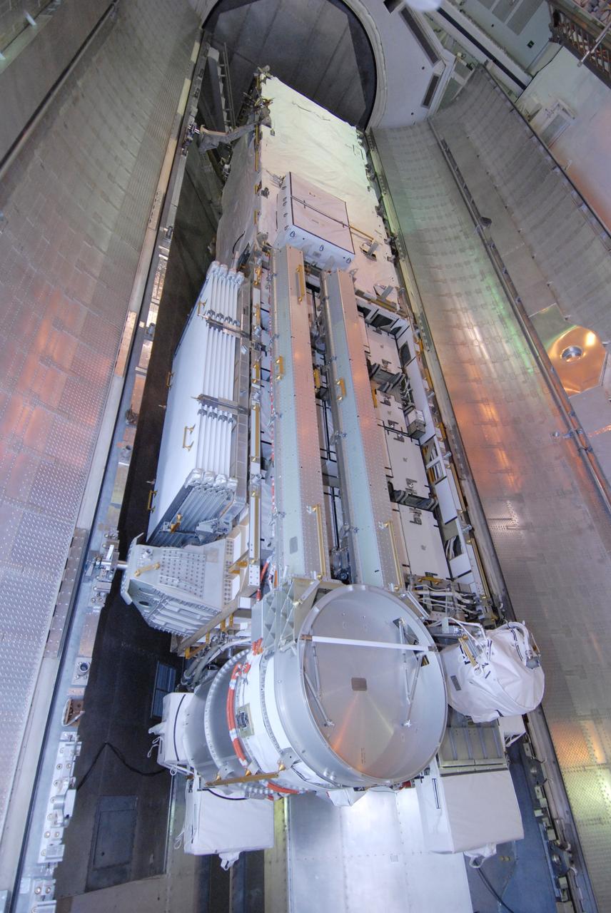 CAPE CANAVERAL, Fla. --  On Launch Pad 39A at NASA's Kennedy Space Center in Florida, the integrated truss structure S6 and solar arrays, the STS-119 mission payload, slowly move out of the payload canister into the Payload Changeout Room, or PCR. They will be installed in space shuttle Discovery's payload bay after the shuttle rolls out to the launch pad. Launch of Discovery on the STS-119 mission is scheduled for Feb. 12. During Discovery's 14-day mission, the crew will install the S6 truss segment and its solar arrays to the starboard side of the station, completing the station's backbone, or truss. Photo credit: NASA/Chris Rhodes