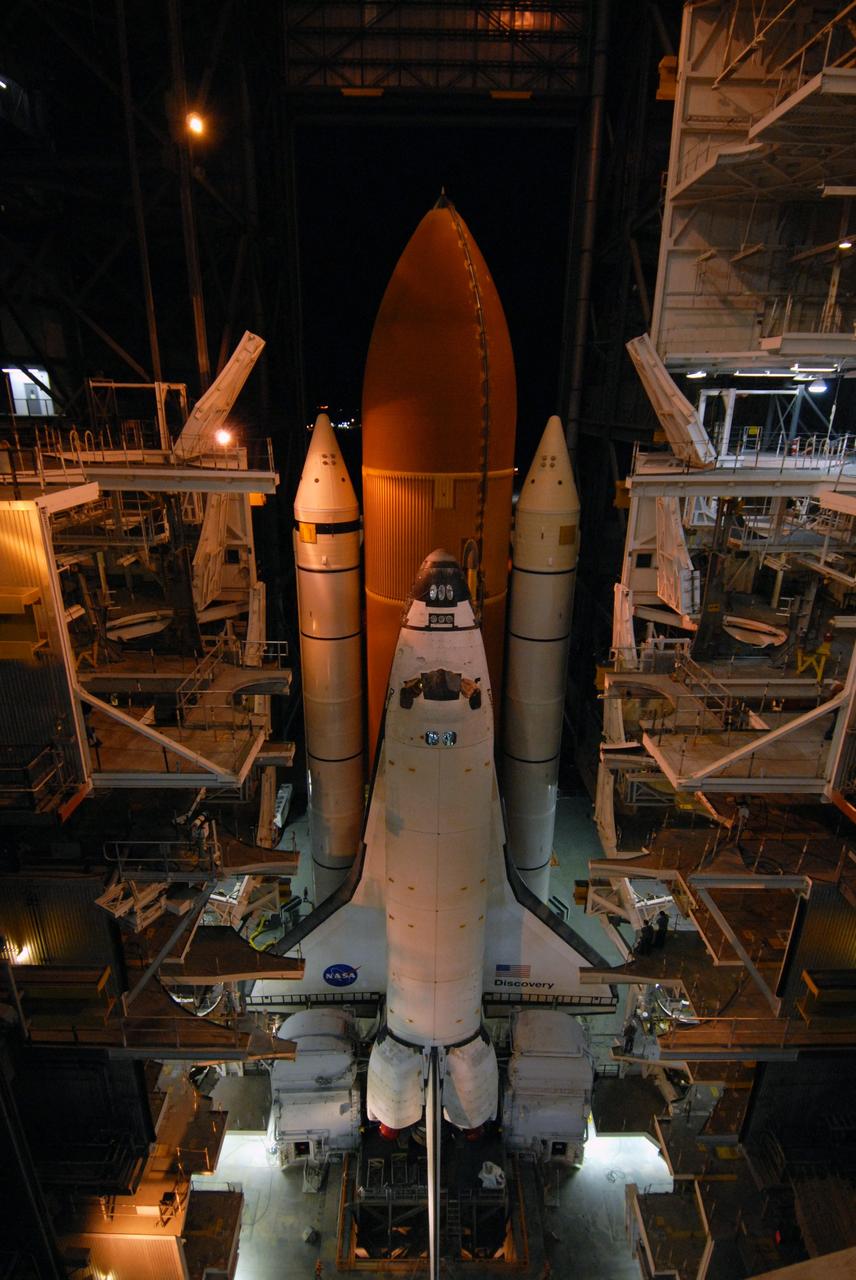 CAPE CANAVERAL, Fla. -- A bright moon bears witness to space shuttle Discovery's rollout from the Vehicle Assembly Building at NASA’s Kennedy Space Center, traveling at less than 1 mph atop a massive crawler-transporter. First motion was at 5:17 a.m. EST. The shuttle and mobile launcher platform are being moved by the massive crawler-transporter to Launch Pad 39A. Discovery is targeted to launch to the International Space Station Feb. 12. During Discovery's 14-day mission, the crew will install the S6 truss segment and its solar arrays to the starboard side of the station, completing the station's backbone, or truss, enabling a six-person crew to live there starting in May. Photo credit: NASA/Troy Cryder