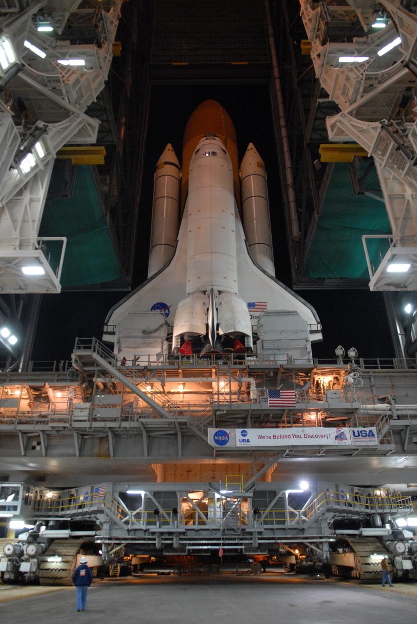 CAPE CANAVERAL, Fla. -- The massive crawler-transporter moves its cargo of space shuttle Discovery and mobile launcher platform out of the Vehicle Assembly Building at NASA's Kennedy Space Center in Florida to Launch Pad 39A. First motion was at 5:17 a.m. EST. Discovery is targeted to launch to the International Space Station Feb. 12. During Discovery's 14-day mission, the crew will install the S6 truss segment and its solar arrays to the starboard side of the station, completing the station's backbone, or truss, enabling a six-person crew to live there starting in May. Photo credit: NASA/Troy Cryder