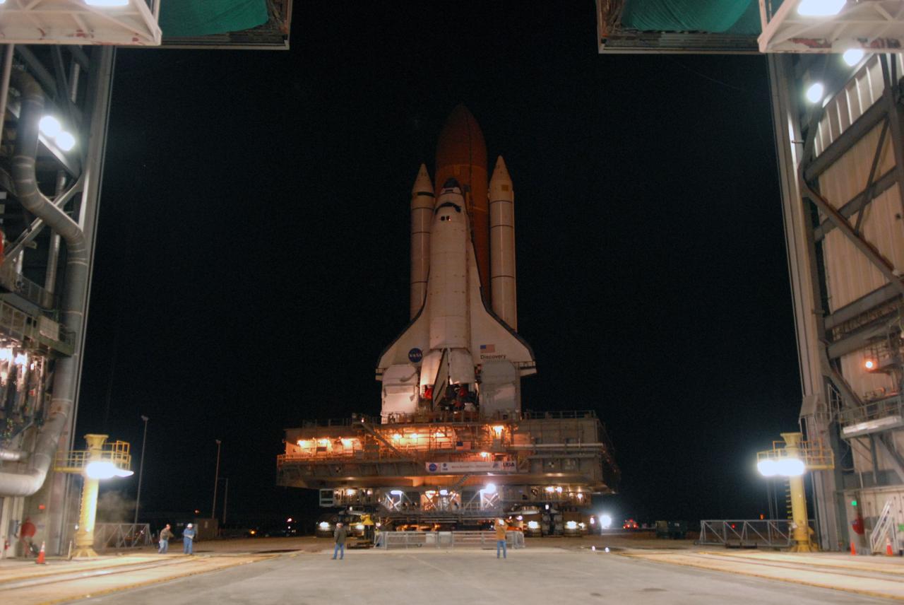 CAPE CANAVERAL, Fla. -- Transported by the massive crawler-transporter underneath, space shuttle Discovery atop the mobile launcher platform head for Launch Pad 39A at NASA's Kennedy Space Center in Florida. First motion was at 5:17 a.m. EST. Discovery is targeted to launch to the International Space Station Feb. 12. During Discovery's 14-day mission, the crew will install the S6 truss segment and its solar arrays to the starboard side of the station, completing the station's backbone, or truss, enabling a six-person crew to live there starting in May. Photo credit: NASA/Troy Cryder