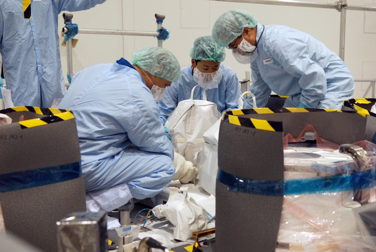 CAPE CANAVERAL, Fla. – In the Space Station Processing Facility at NASA's Kennedy Space Center in Florida, members of the STS-127 crew check out equipment related to the Japanese Experiment Module's Experiment Logistics Module-Exposed Section, or ELM-ES, part of the payload on the mission.  The crew is Commander Mark Polansky, Pilot Doug Hurley and Mission Specialists Christopher Cassidy, Tom Marshburn, Dave Wolf, Julie Payette and Tim Kopra. They are at Kennedy for Crew Equipment Interface Test activities, or CEIT, which provides experience handling tools, equipment and hardware for the mission. The payload will be launched to the International Space Station aboard space shuttle Endeavour on the STS-127 mission, targeted for launch on May 15. Photo credit: NASA/Dimitrios Gerondidakis