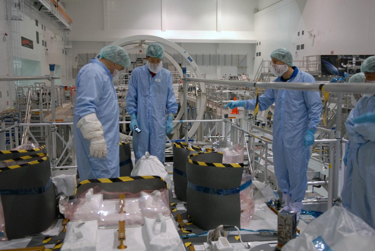 CAPE CANAVERAL, Fla. – In the Space Station Processing Facility at NASA's Kennedy Space Center in Florida, members of the STS-127 crew look over equipment on the Japanese Experiment Module's Experiment Logistics Module-Exposed Section, or ELM-ES, part of the payload on the mission.  The crew is  Commander Mark Polansky, Pilot Doug Hurley and Mission Specialists Christopher Cassidy, Tom Marshburn, Dave Wolf, Julie Payette and Tim Kopra. They are at Kennedy for Crew Equipment Interface Test activities, or CEIT, which provides experience handling tools, equipment and hardware for the mission. The payload will be launched to the International Space Station aboard space shuttle Endeavour on the STS-127 mission, targeted for launch on May 15. Photo credit: NASA/Dimitrios Gerondidakis