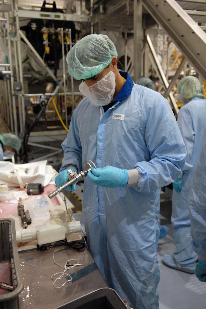 CAPE CANAVERAL, Fla. – In the Space Station Processing Facility at NASA's Kennedy Space Center in Florida, members of the STS-127 Mission Specialist Chris Cassidy prepares the tools he will use on-orbit to set up the Japanese Experiment Module's Experiment Logistics Module-Exposed Section, or ELM-ES, part of the payload on the mission. The crew members are at Kennedy for Crew Equipment Interface Test activities, or CEIT, which provides experience handling tools, equipment and hardware for the mission.  The payload will be launched to the International Space Station aboard space shuttle Endeavour on the STS-127 mission, targeted for launch on May 15. Photo credit: NASA/Dimitrios Gerondidakis