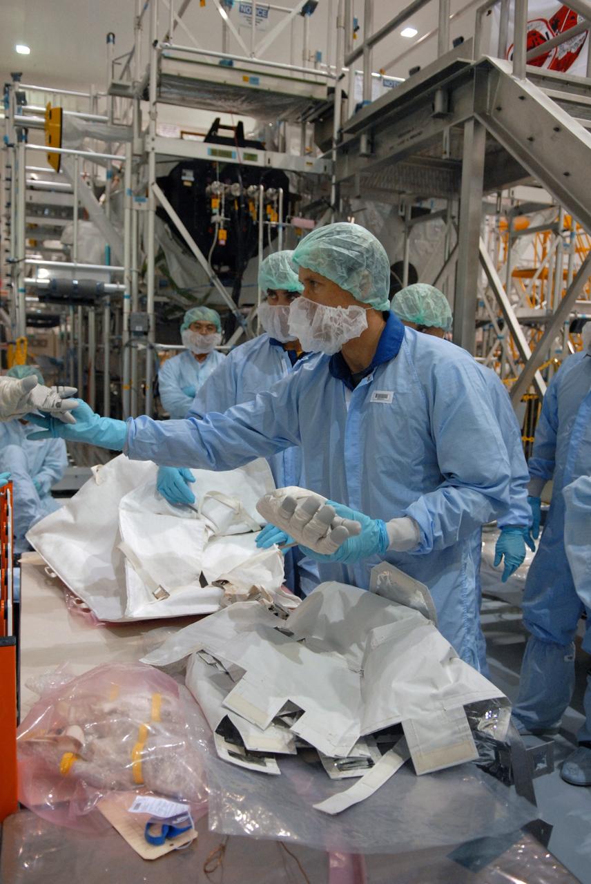 CAPE CANAVERAL, Fla. –  In the Space Station Processing Facility at NASA's Kennedy Space Center in Florida, members of the STS-127 crew check out equipment related to the Japanese Experiment Module's Experiment Logistics Module-Exposed Section, or ELM-ES, part of the payload on the mission.  The crew is  Commander Mark Polansky, Pilot Doug Hurley and Mission Specialists Christopher Cassidy, Tom Marshburn, Dave Wolf, Julie Payette and Tim Kopra. They are at Kennedy for Crew Equipment Interface Test activities, or CEIT, which provides experience handling tools, equipment and hardware for the mission. The payload will be launched to the International Space Station aboard space shuttle Endeavour on the STS-127 mission, targeted for launch on May 15. Photo credit: NASA/Dimitrios Gerondidakis