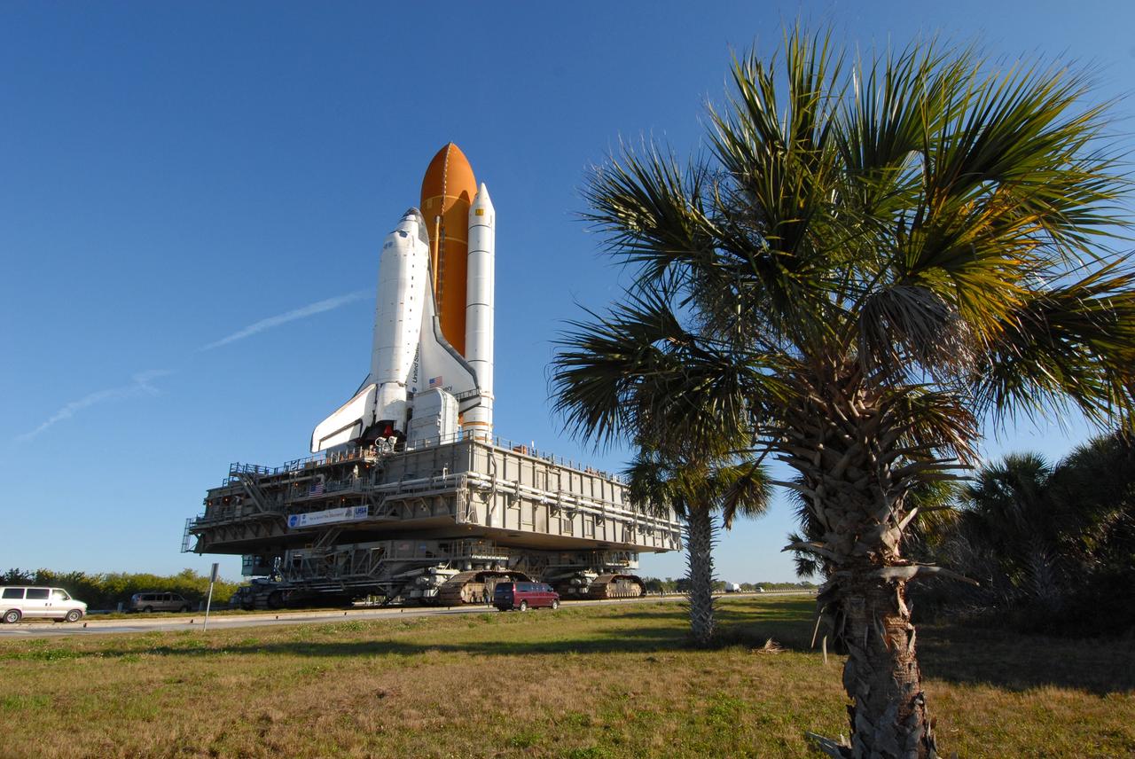 CAPE CANAVERAL, Fla. --  Space shuttle Discovery, atop the mobile launcher platform, makes the slow 3.4-mile journey via the massive crawler-transporter to Launch Pad 39A at NASA's Kennedy Space Center in Florida.  First motion out of the Vehicle Assembly Building was at 5:17 a.m. EST.  Discovery was secured to the pad at 12:16 p.m. Discovery is targeted to launch to the International Space Station Feb. 12. During Discovery's 14-day mission, the crew will install the S6 truss segment and its solar arrays to the starboard side of the station, completing the station's backbone, or truss, enabling a six-person crew to live there starting in May.  Photo credit: NASA/Troy Cryder