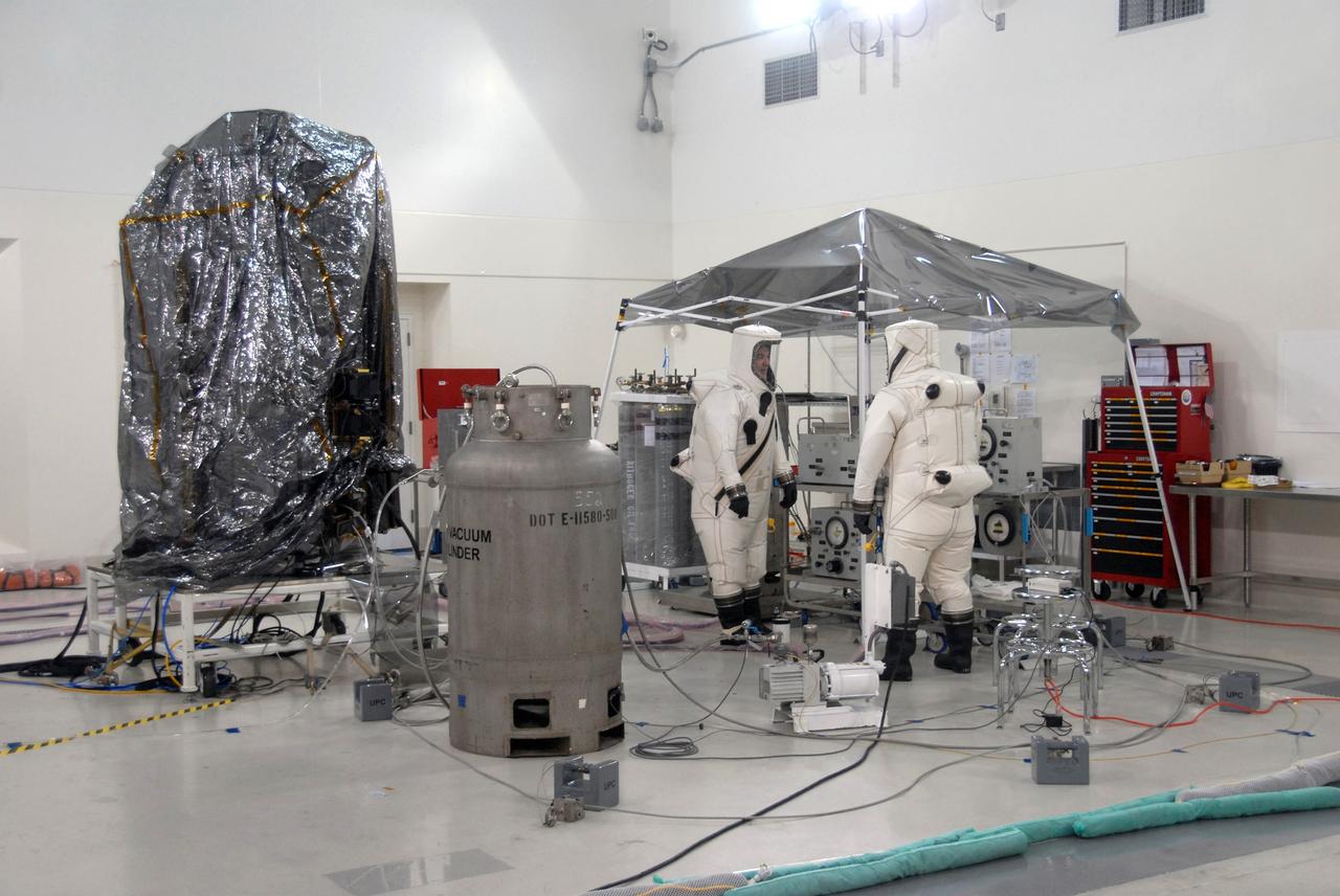 Vandenberg Air Force Base, Calif. –  In the Astrotech Payload Processing Facility at Vandenberg Air Force Base in California, preparations are under way to fuel NASA's Orbiting Carbon Observatory, or OCO, with hydrazine thruster control propellant. The OCO is a new Earth-orbiting mission sponsored by NASA's Earth System Science Pathfinder Program. The OCO mission will collect precise global measurements of carbon dioxide (CO2) in the Earth's atmosphere. Scientists will analyze OCO data to improve our understanding of the natural processes and human activities that regulate the abundance and distribution of this important greenhouse gas. This improved understanding will enable more reliable forecasts of future changes in the abundance and distribution of CO2 in the atmosphere and the effect that these changes may have on the Earth's climate. The launch of OCO is scheduled for Feb. 23 from Vandenberg. Photo credit: Robert Hargreaves Jr., VAFB