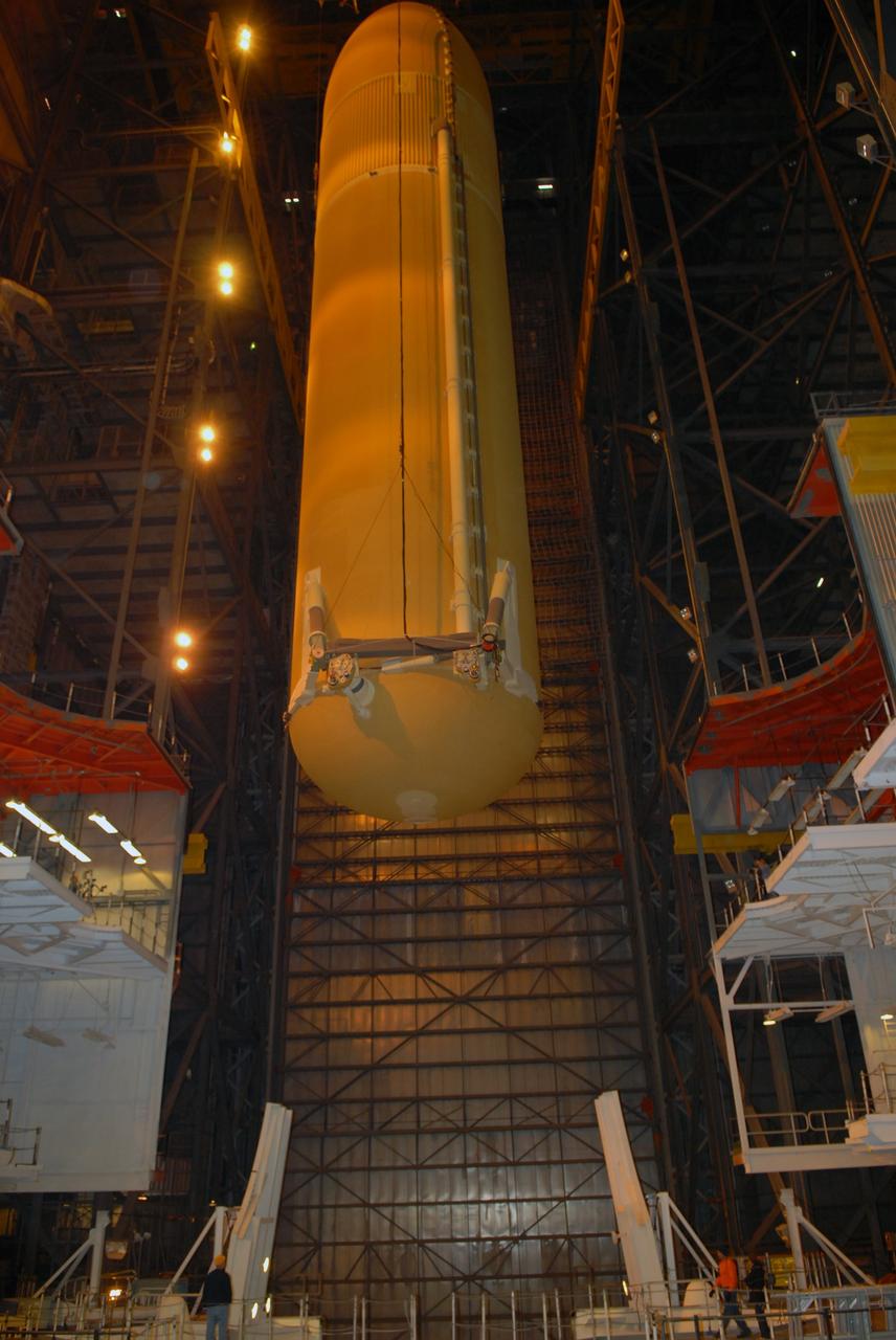 CAPE CANAVERAL, Fla. –  In the Vehicle Assembly Building at NASA's Kennedy Space Center in Florida, the external fuel tank for space shuttle Atlantis' STS-125 mission is lowered into high bay 3.  It will be installed on the mobile launcher platform and attached to the solid rocket boosters already there. Atlantis' STS-125 mission is the fifth and final shuttle servicing mission to NASA’s Hubble Space Telescope.  Launch is targeted for May 12.  Photo credit: NASA/Jack Pfaller