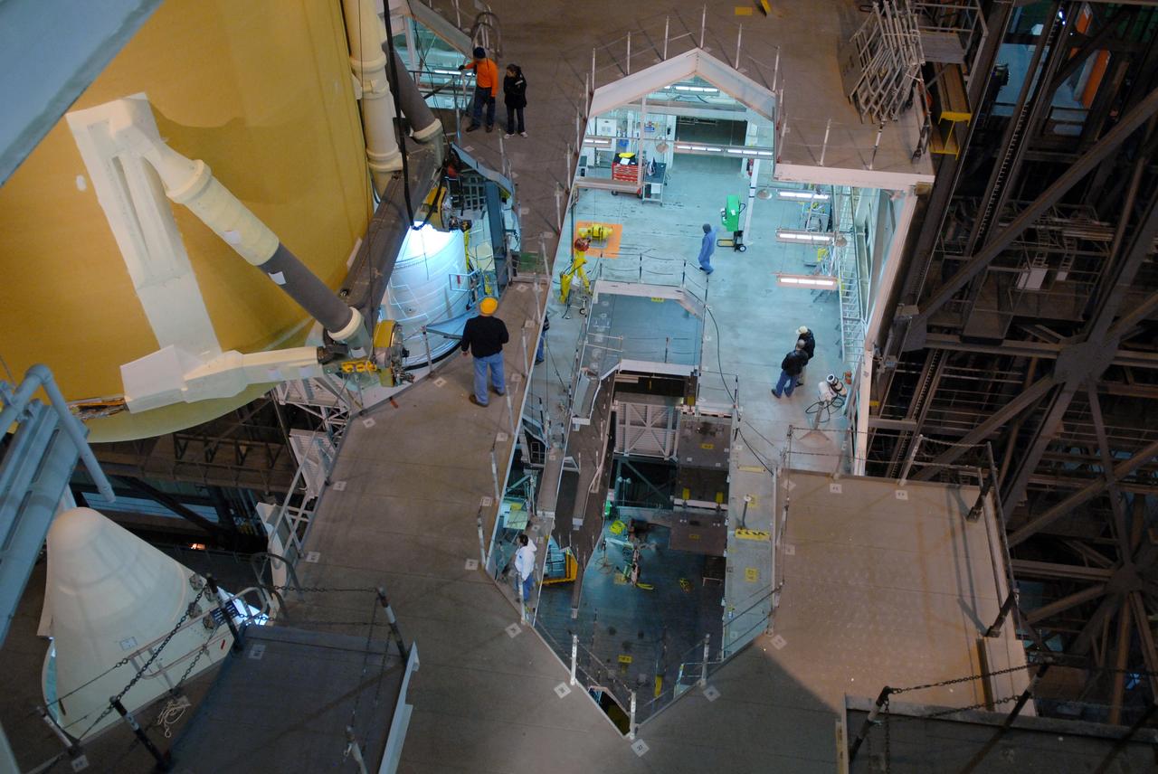 CAPE CANAVERAL, Fla. –  In the Vehicle Assembly Building at NASA's Kennedy Space Center in Florida, the external fuel tank for space shuttle Atlantis' STS-125 mission is lowered into high bay 3.  It will be installed on the mobile launcher platform and attached to the solid rocket boosters already there.  Atlantis' STS-125 mission is the fifth and final shuttle servicing mission to NASA’s Hubble Space Telescope.  Launch is targeted for May 12.  Photo credit: NASA/Jack Pfaller