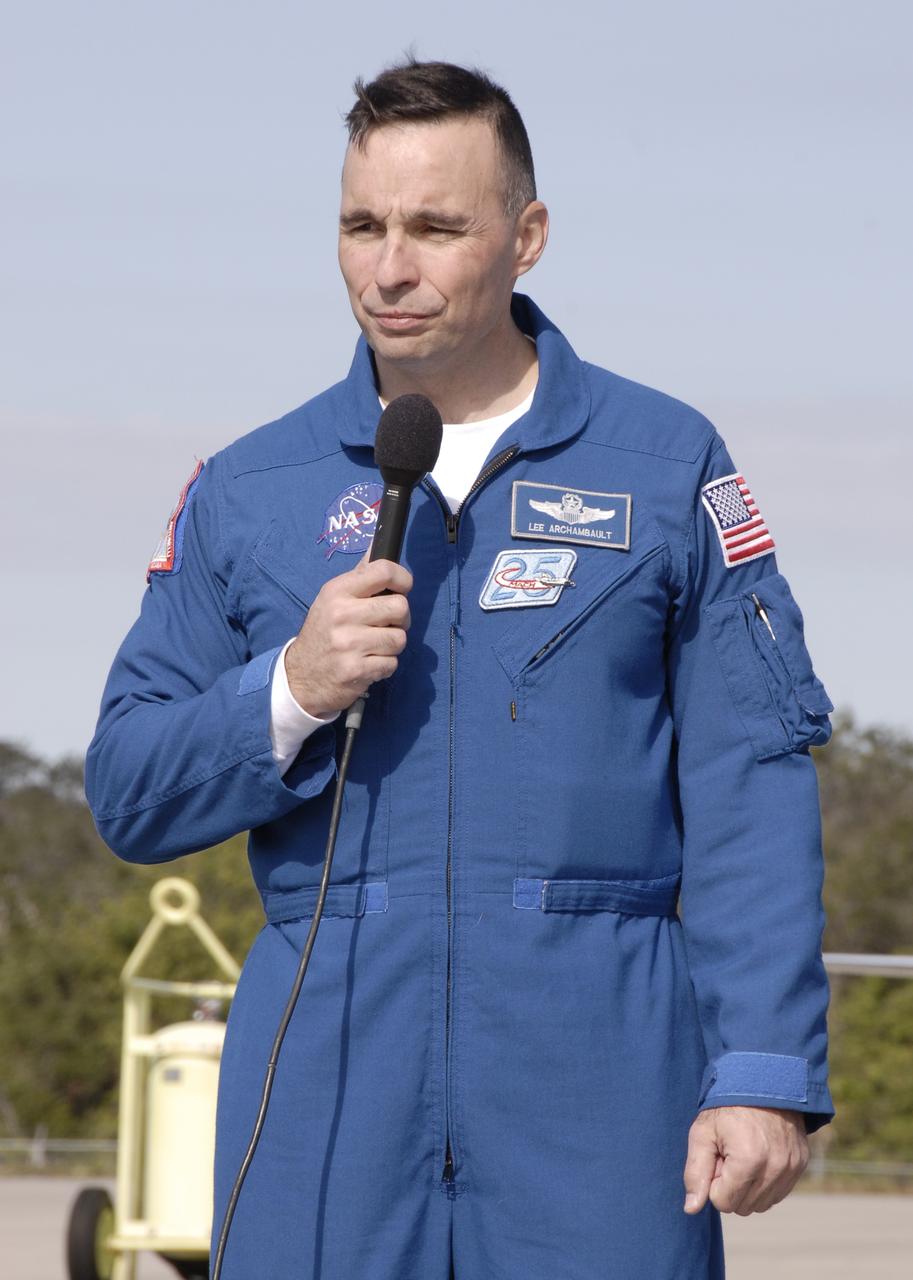 CAPE CANAVERAL, Fla. –   STS-119 Commander Lee Archambault greets the media after the crew's arrival at NASA's Kennedy Space Center in Florida.  He and other crew members explained their roles in the upcoming mission and answered reporters' questions. The crew flew to Kennedy to take part in terminal countdown demonstration test activities, which include equipment familiarization and emergency exit training and culminate in a simulated launch countdown. Photo credit: NASA/Kim Shiflett