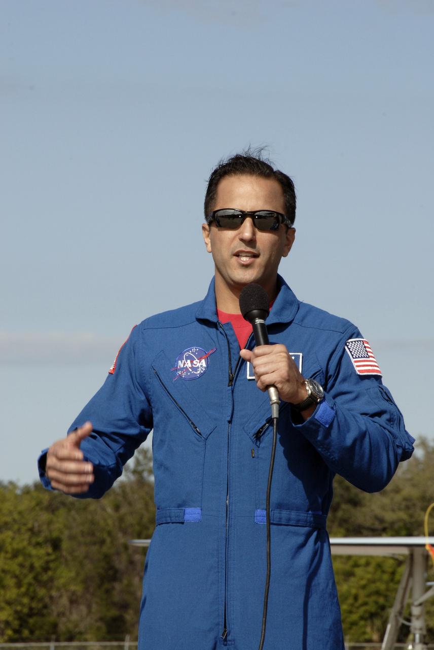 CAPE CANAVERAL, Fla. –    After arriving at NASA's Kennedy Space Center in Florida, STS-119 Mission Specialist Joseph Acaba explains his role in the mission to media gathered for a question-and-answer session. The crew flew to Kennedy to take part in terminal countdown demonstration test activities, which include equipment familiarization and emergency exit training and culminate in a simulated launch countdown. Photo credit: NASA/Kim Shiflett