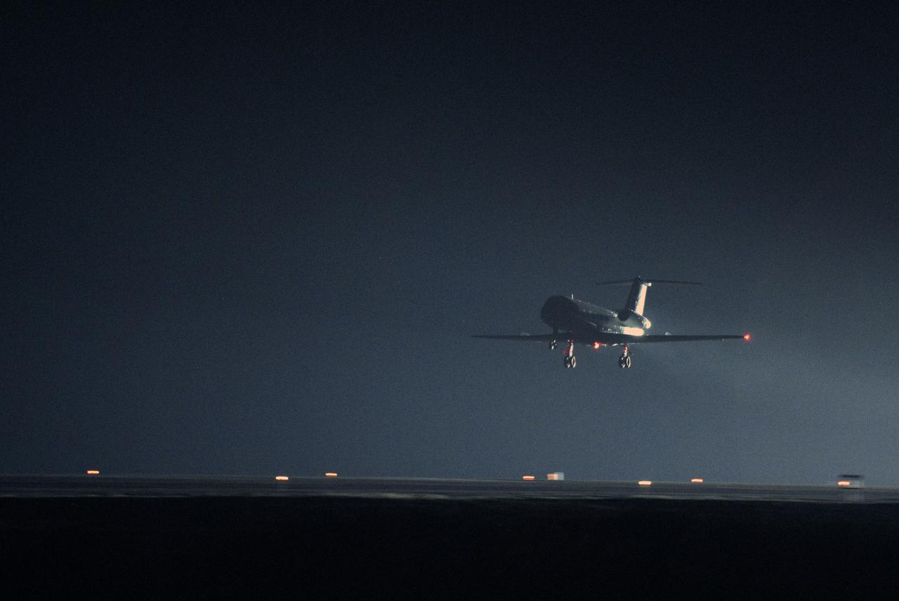CAPE CANAVERAL, Fla. –  A shuttle training aircraft drops for touchdown on the Shuttle Landing Facility runway at NASA's Kennedy Space Center in Florida.  STS-119 Commander Lee Archambault and Pilot Tony Antonelli are practicing shuttle landings as part of the Terminal Countdown Demonstration Test activities. The TCDT includes equipment familiarization and a simulated launch countdown. The STA is a Grumman American Aviation-built Gulf Stream II jet that was modified to simulate a shuttle’s cockpit, motion and visual cues, and handling qualities. In flight, the aircraft duplicates the shuttle’s atmospheric descent trajectory from approximately 35,000 feet to landing. The crew of space shuttle Discovery is targeted to launch on the STS-119 mission Feb. 12. During Discovery's 14-day mission, the crew will install the S6 truss segment and solar arrays to the starboard side of the International Space Station, completing the station's truss, or backbone.   Photo credit: NASA/Kim Shiflett