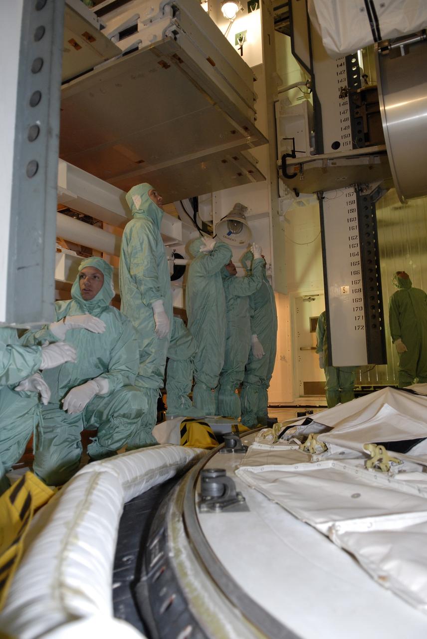 CAPE CANAVERAL, Fla. – On Launch Pad 39A at NASA's Kennedy Space Center in Florida, STS-119 crew members get a close look at the cargo installed in space shuttle Discovery's payload bay. The cargo consists of the integrated truss structure S6 and solar arrays. The astronauts are at Kennedy to prepare for launch through Terminal Countdown Demonstration Test activities. The TCDT includes equipment familiarization and a simulated launch countdown. Discovery is targeted to launch on the STS-119 mission Feb. 12. During Discovery's 14-day mission, the crew will install the S6 truss segment and solar arrays to the starboard side of the International Space Station, completing the station's truss, or backbone. Photo credit: NASA/Kim Shiflett