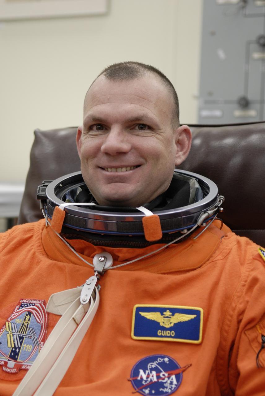 CAPE CANAVERAL, Fla. –   At NASA's Kennedy Space Center in Florida, STS-119 Pilot Tony Antonelli dons his launch-and-entry suit before heading to Launch Pad 39A for a simulated launch countdown.  The astronauts are at Kennedy to prepare for launch through Terminal Countdown Demonstration Test activities. The TCDT includes equipment familiarization and emergency egress training. The crew is targeted to launch on the STS-119 mission Feb. 12 on space shuttle Discovery. During the 14-day mission, the crew will install the S6 truss segment and solar arrays to the starboard side of the International Space Station, completing the station's truss, or backbone.    Photo credit: NASA/Kim Shiflett