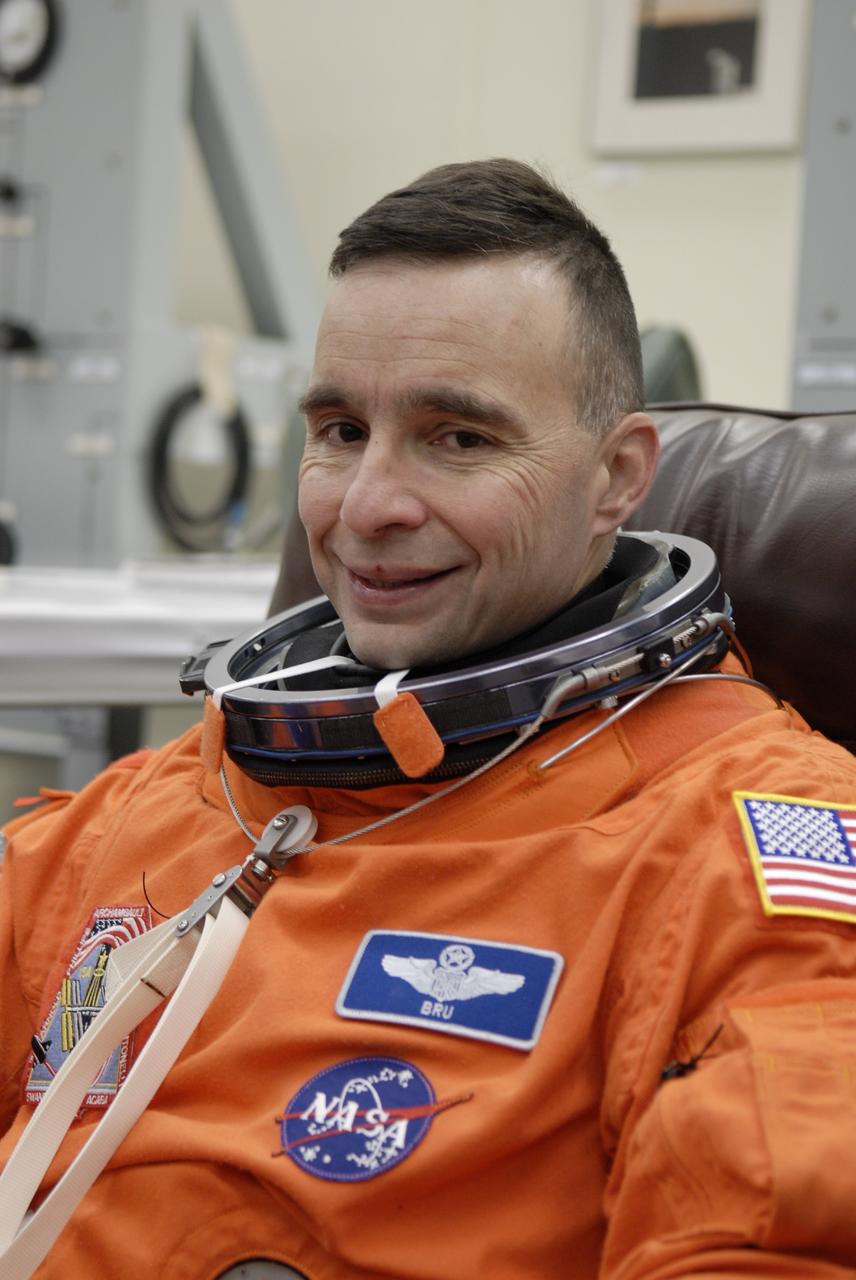 CAPE CANAVERAL, Fla. –    At NASA's Kennedy Space Center in Florida, STS-119 Commander Lee Archambault dons his launch-and-entry suit before heading to Launch Pad 39A for a simulated launch countdown.  The astronauts are at Kennedy to prepare for launch through Terminal Countdown Demonstration Test activities. The TCDT includes equipment familiarization and emergency egress training. The crew is targeted to launch on the STS-119 mission Feb. 12 on space shuttle Discovery. During the 14-day mission, the crew will install the S6 truss segment and solar arrays to the starboard side of the International Space Station, completing the station's truss, or backbone.    Photo credit: NASA/Kim Shiflett