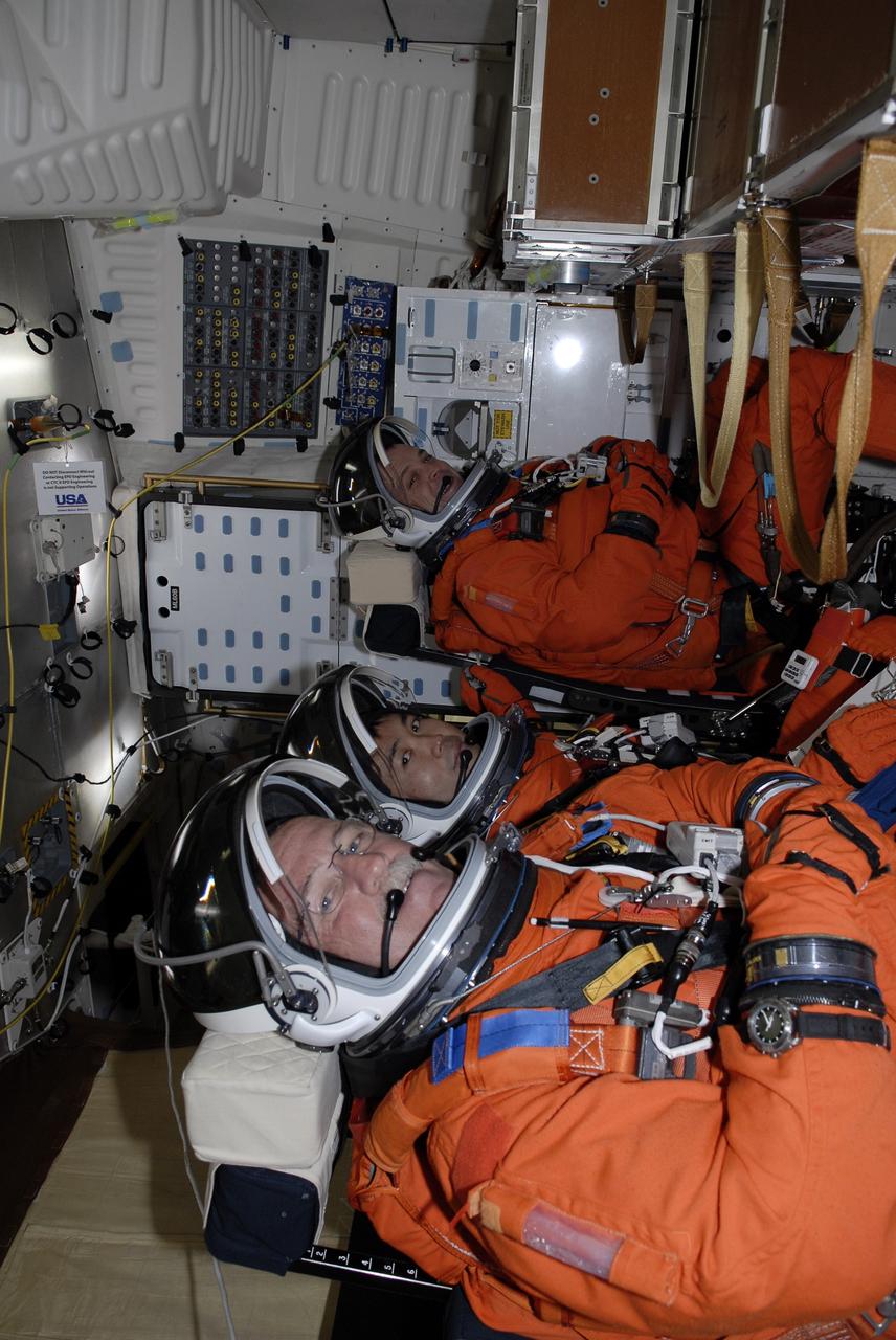 CAPE CANAVERAL, Fla. –  On Launch Pad 39A at NASA's Kennedy Space Center in Florida, STS-119 Mission Specialists John Phillips, Koichi Wakata and Richard Arnold are seated in space shuttle Discovery for a simulated launch countdown as part of the prelaunch preparation known as Terminal Countdown Demonstration Test.  The TCDT also includes equipment familiarization. Discovery is targeted to launch on the STS-119 mission Feb. 12. During the 14-day mission, the crew will install the S6 truss segment and solar arrays to the starboard side of the International Space Station, completing the station's truss, or backbone. Photo credit: NASA/Kim Shiflett