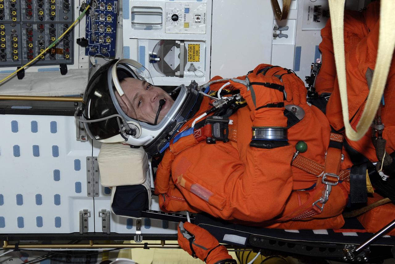CAPE CANAVERAL, Fla. –  On Launch Pad 39A at NASA's Kennedy Space Center in Florida, STS-119 Mission Specialist Richard Arnold is seated in space shuttle Discovery for a simulated launch countdown as part of the prelaunch preparation known as Terminal Countdown Demonstration Test.  The TCDT also includes equipment familiarization. Discovery is targeted to launch on the STS-119 mission Feb. 12. During the 14-day mission, the crew will install the S6 truss segment and solar arrays to the starboard side of the International Space Station, completing the station's truss, or backbone. Photo credit: NASA/Kim Shiflett