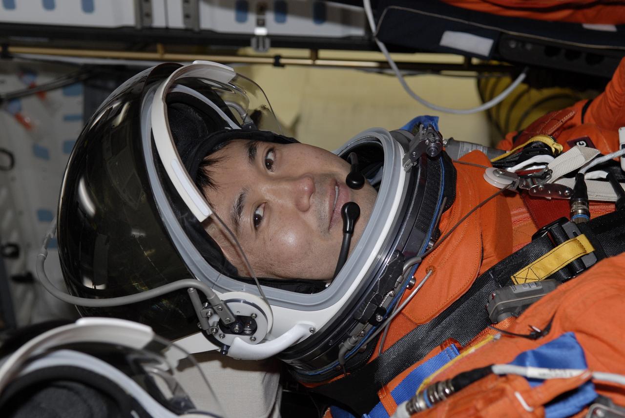 CAPE CANAVERAL, Fla. –  On Launch Pad 39A at NASA's Kennedy Space Center in Florida, STS-119 Mission Specialist Koichi Wakata is seated in space shuttle Discovery for a simulated launch countdown as part of the prelaunch preparation known as Terminal Countdown Demonstration Test.  The TCDT also includes equipment familiarization. Discovery is targeted to launch on the STS-119 mission Feb. 12. During the 14-day mission, the crew will install the S6 truss segment and solar arrays to the starboard side of the International Space Station, completing the station's truss, or backbone. Photo credit: NASA/Kim Shiflett