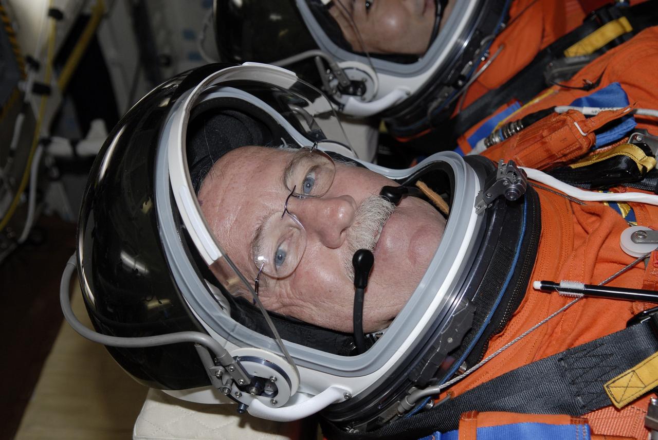 CAPE CANAVERAL, Fla. –  On Launch Pad 39A at NASA's Kennedy Space Center in Florida, STS-119 Mission Specialist John Phillips is seated in space shuttle Discovery for a simulated launch countdown as part of the prelaunch preparation known as Terminal Countdown Demonstration Test. The TCDT also includes equipment familiarization. Discovery is targeted to launch on the STS-119 mission Feb. 12. During the 14-day mission, the crew will install the S6 truss segment and solar arrays to the starboard side of the International Space Station, completing the station's truss, or backbone. Photo credit: NASA/Kim Shiflett