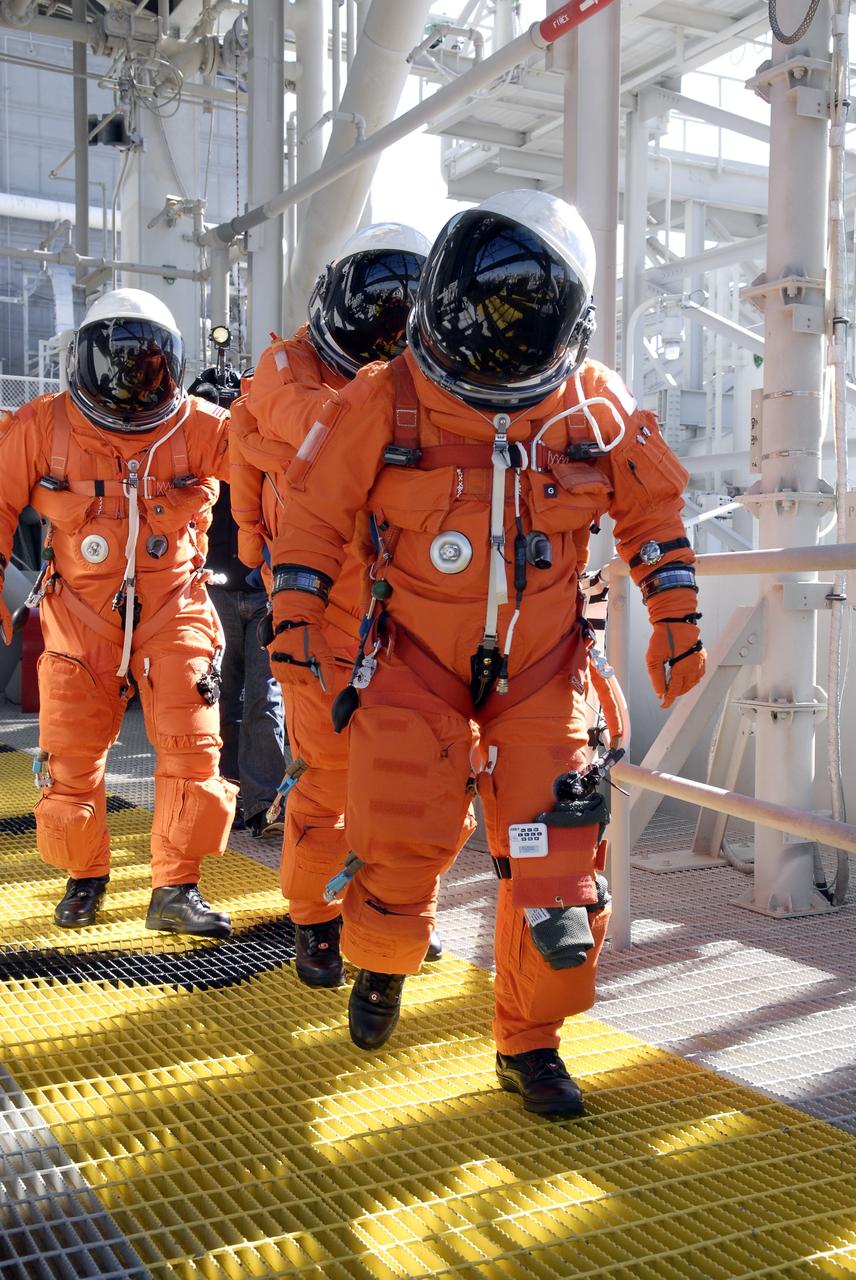 CAPE CANAVERAL, Fla. –  Following the simulated launch countdown on Launch Pad 39A at NASA's Kennedy Space Center in Florida, STS-119 crew members practice an emergency egress from the 195-foot level of the fixed service structure as part of the prelaunch preparation known as Terminal Countdown Demonstration Test.  The TCDT also includes equipment familiarization. Discovery is targeted to launch on the STS-119 mission Feb. 12. During the 14-day mission, the crew will install the S6 truss segment and solar arrays to the starboard side of the International Space Station, completing the station's truss, or backbone. Photo credit: NASA/Kim Shiflett