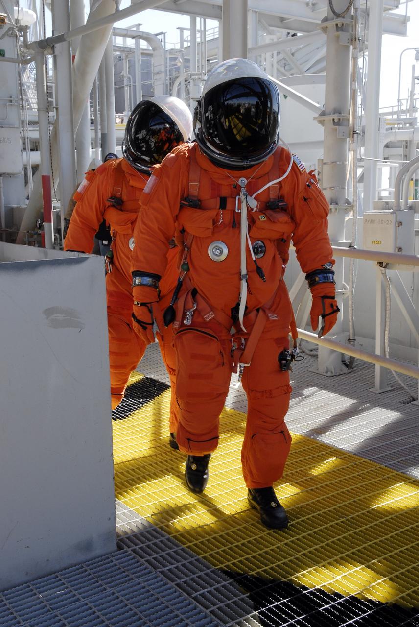 CAPE CANAVERAL, Fla. – Following the simulated launch countdown on Launch Pad 39A at NASA's Kennedy Space Center in Florida, STS-119 crew members practice an emergency egress from the 195-foot level of the fixed service structure as part of the prelaunch preparation known as Terminal Countdown Demonstration Test.  The TCDT also includes equipment familiarization. Discovery is targeted to launch on the STS-119 mission Feb. 12. During the 14-day mission, the crew will install the S6 truss segment and solar arrays to the starboard side of the International Space Station, completing the station's truss, or backbone. Photo credit: NASA/Kim Shiflett