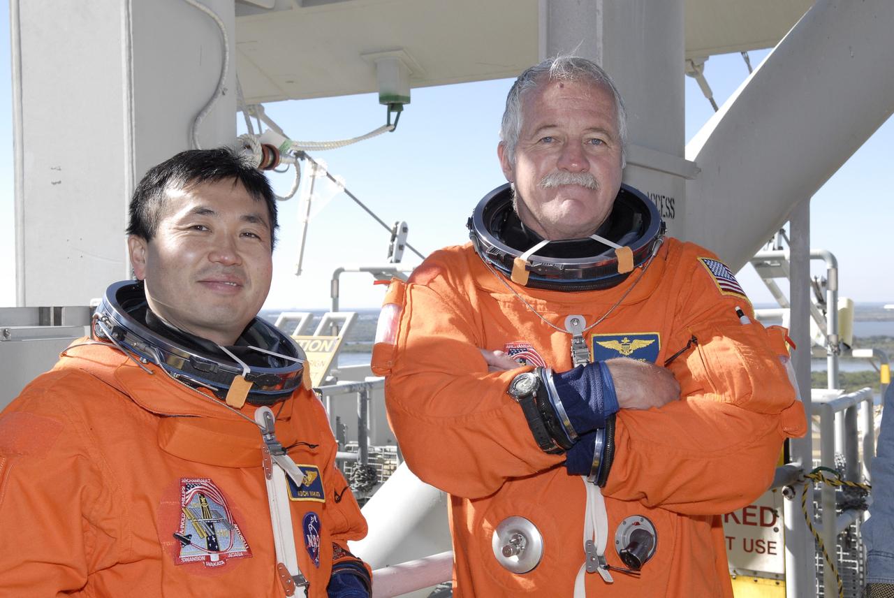 CAPE CANAVERAL, Fla. –  On Launch Pad 39A at NASA's Kennedy Space Center in Florida, STS-119 Mission Specialists Koichi Wakata and John Phillips complete emergency egress training from the pad.  Practicing emergency egress is part of the prelaunch preparation known as Terminal Countdown Demonstration Test. The TCDT also includes equipment familiarization. Discovery is targeted to launch on the STS-119 mission Feb. 12. During the 14-day mission, the crew will install the S6 truss segment and solar arrays to the starboard side of the International Space Station, completing the station's truss, or backbone. Photo credit: NASA/Kim Shiflett